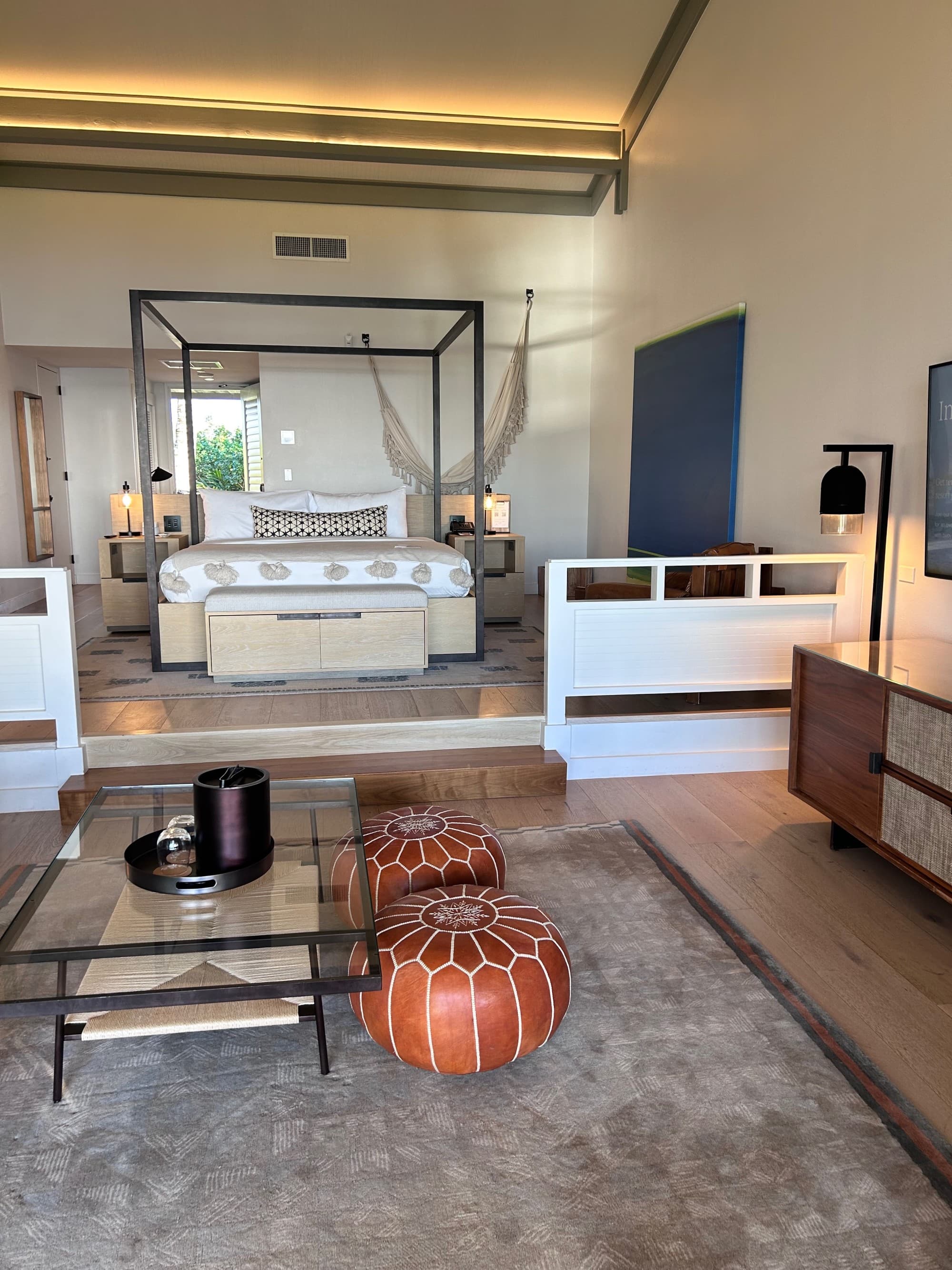 A hotel room with a canopy bed