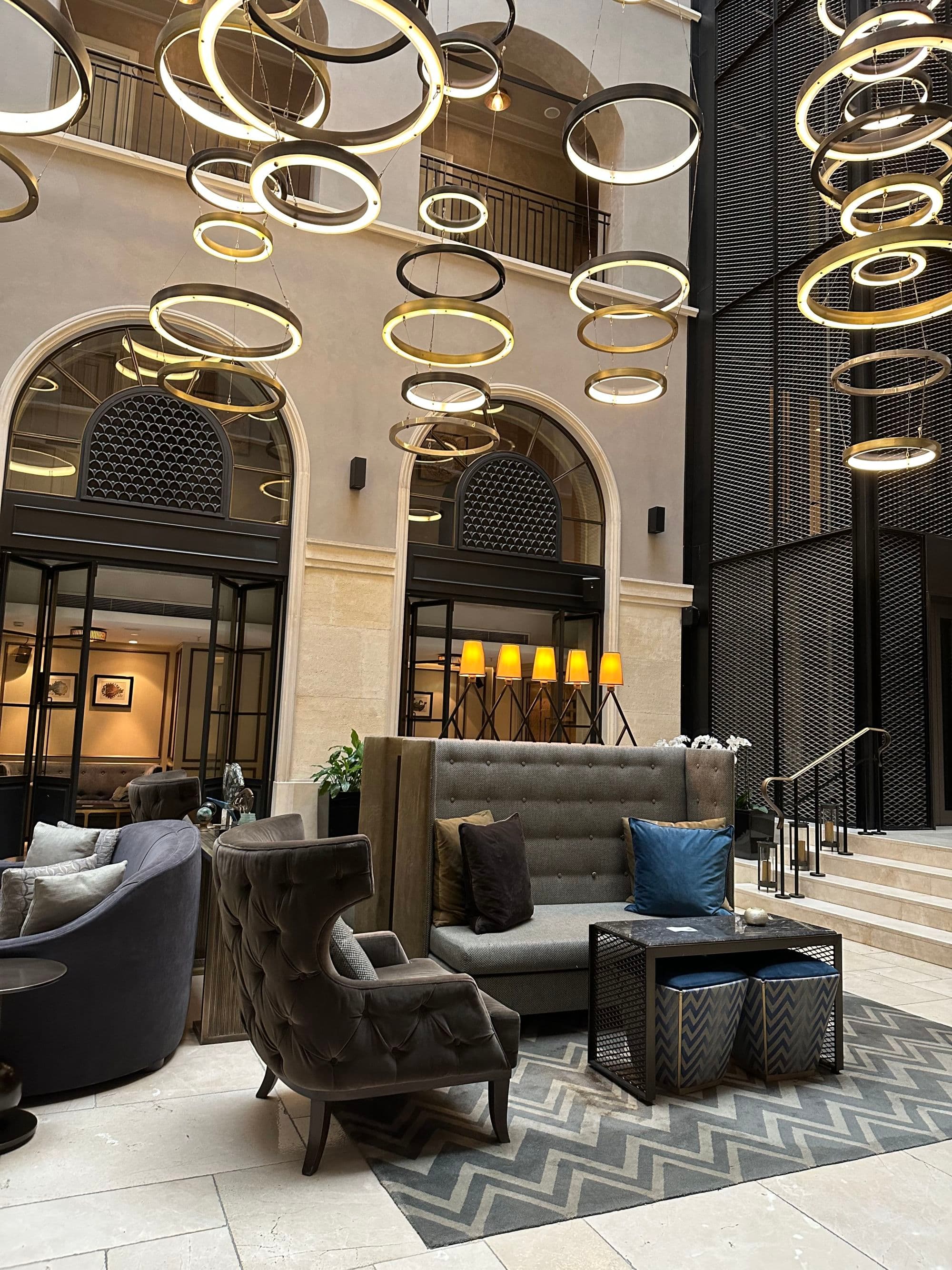 A group of couches and soft chairs in the lobby