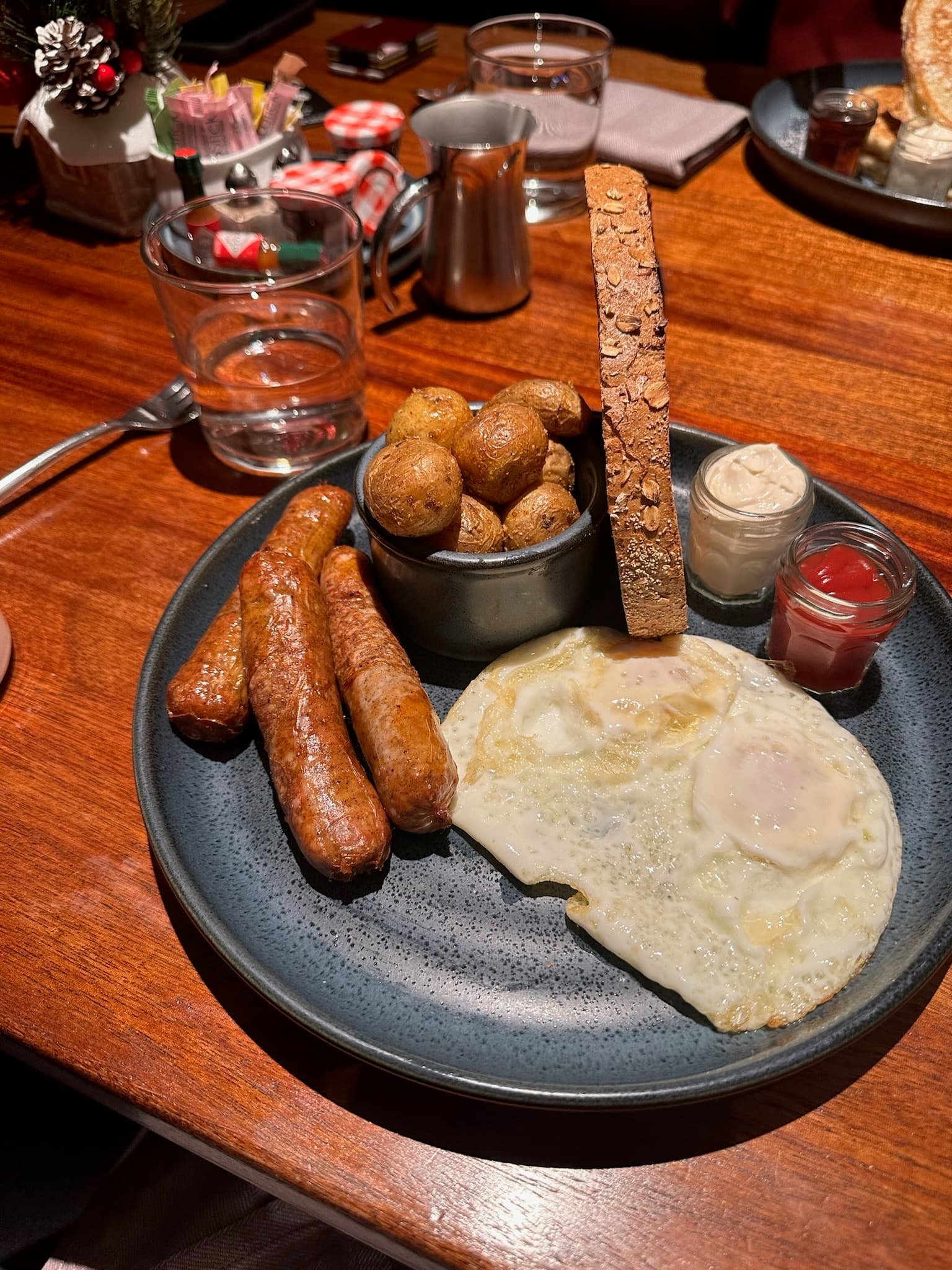 Food on a plate sitting on a wooden table