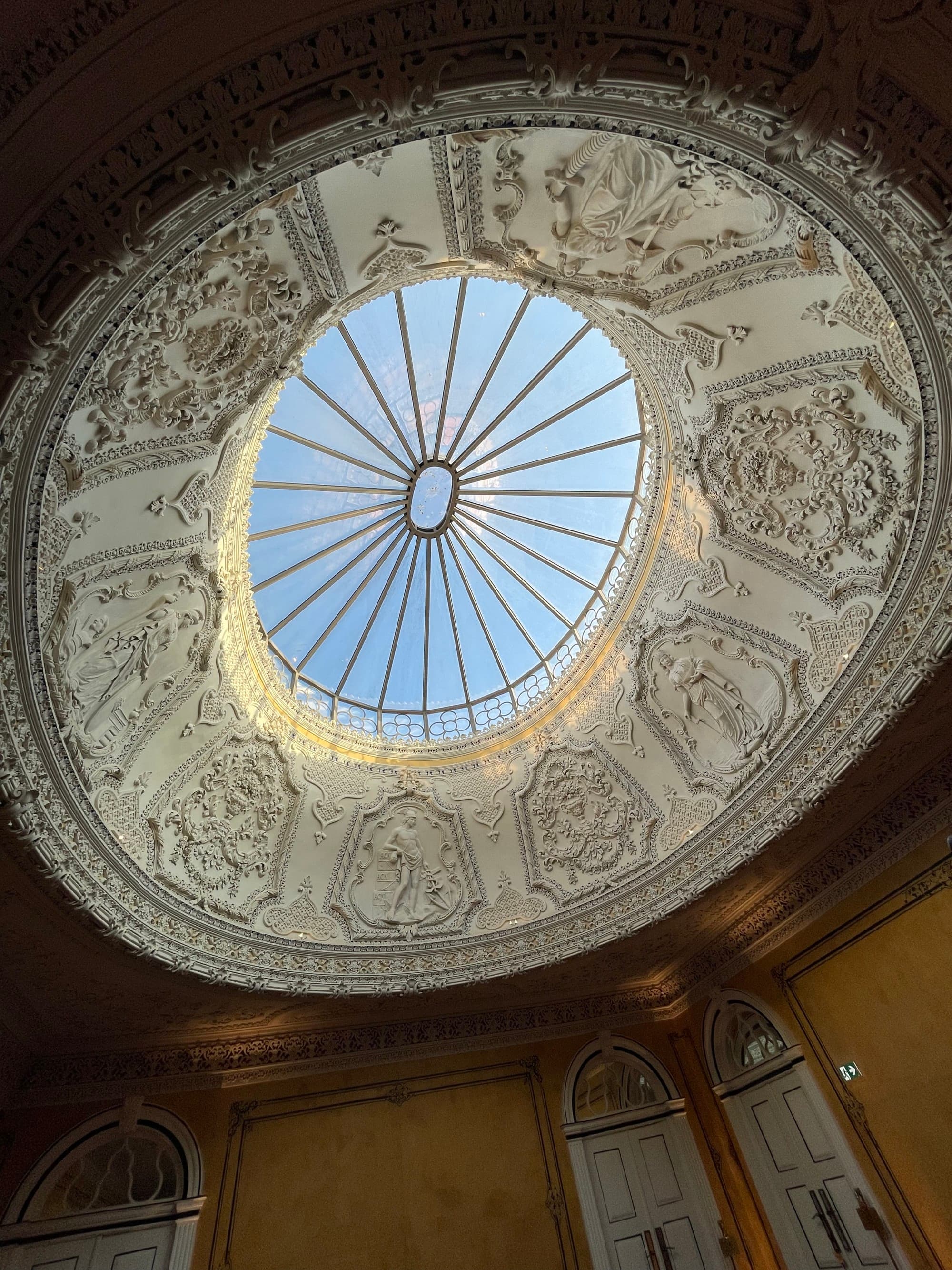 White ceiling design with bars and sky view