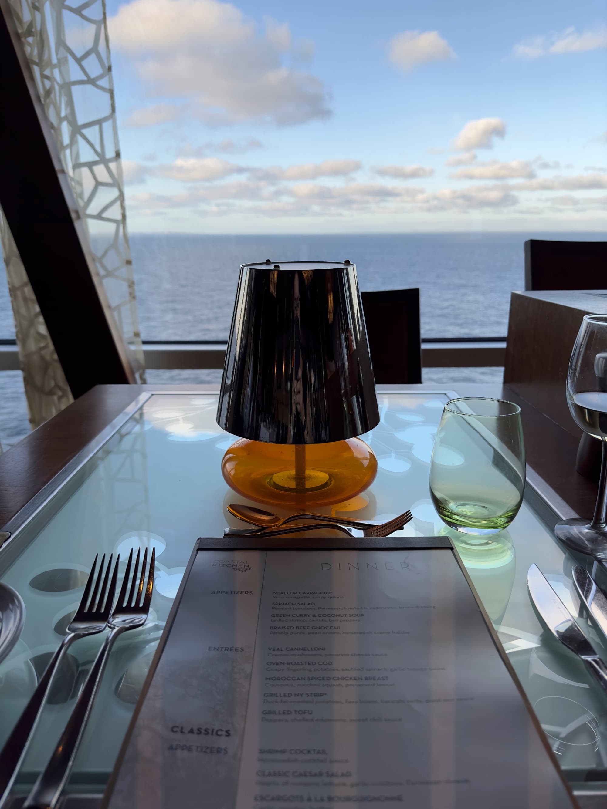 A table in a restaurant with a view of the ocean