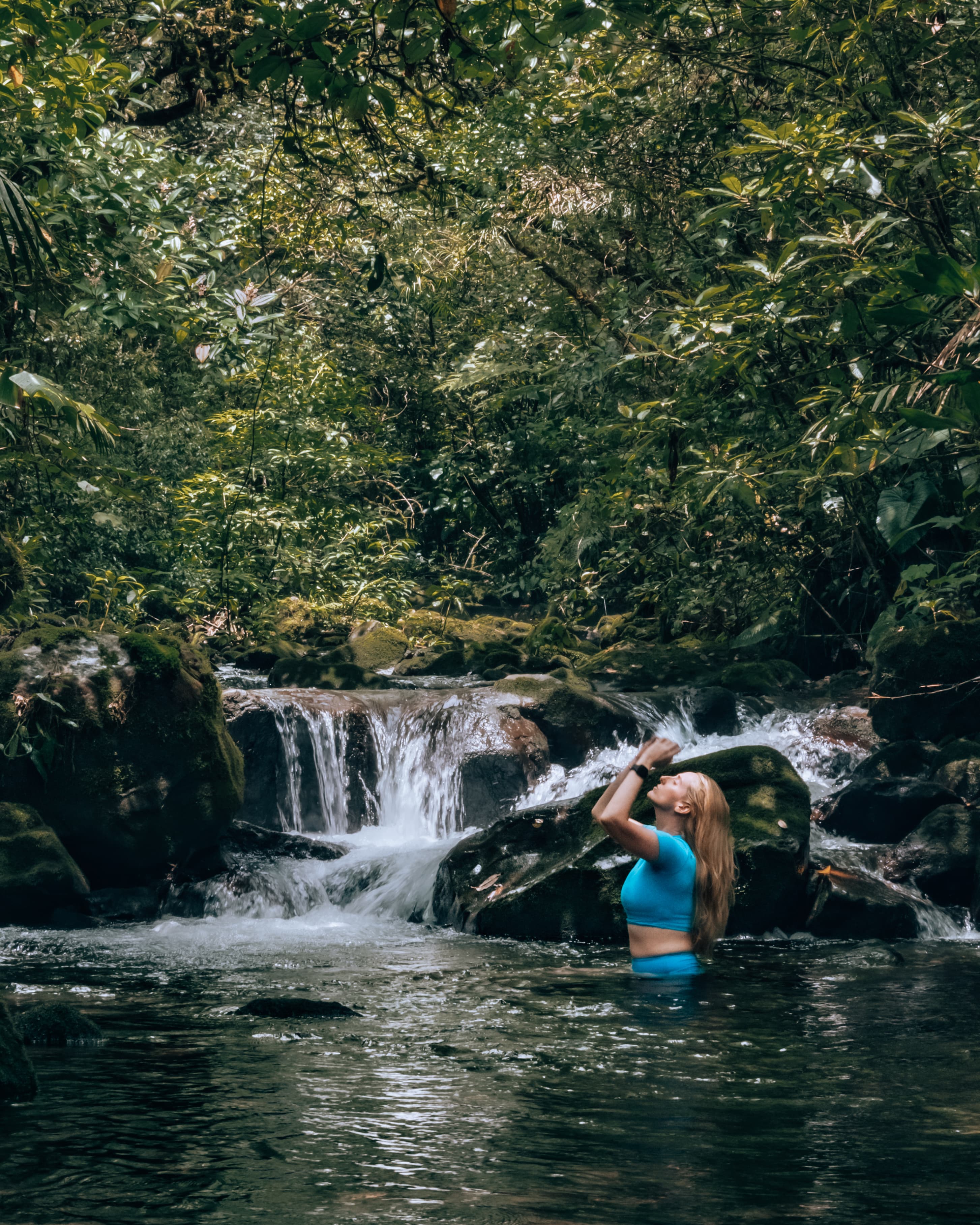 Travel advisor posing in a lake