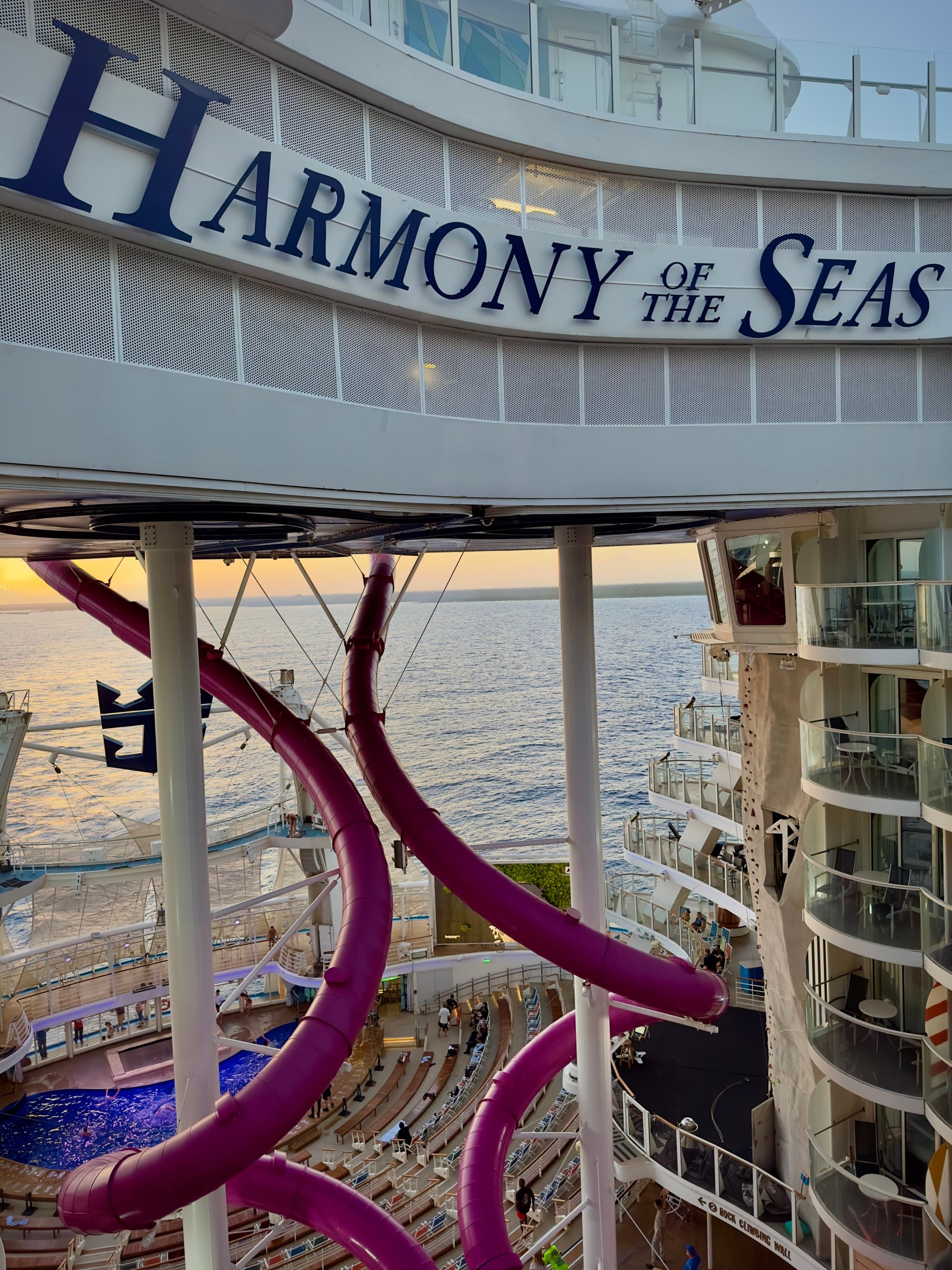 A sign reading "Harmony of the Seas" on a cruise ship
