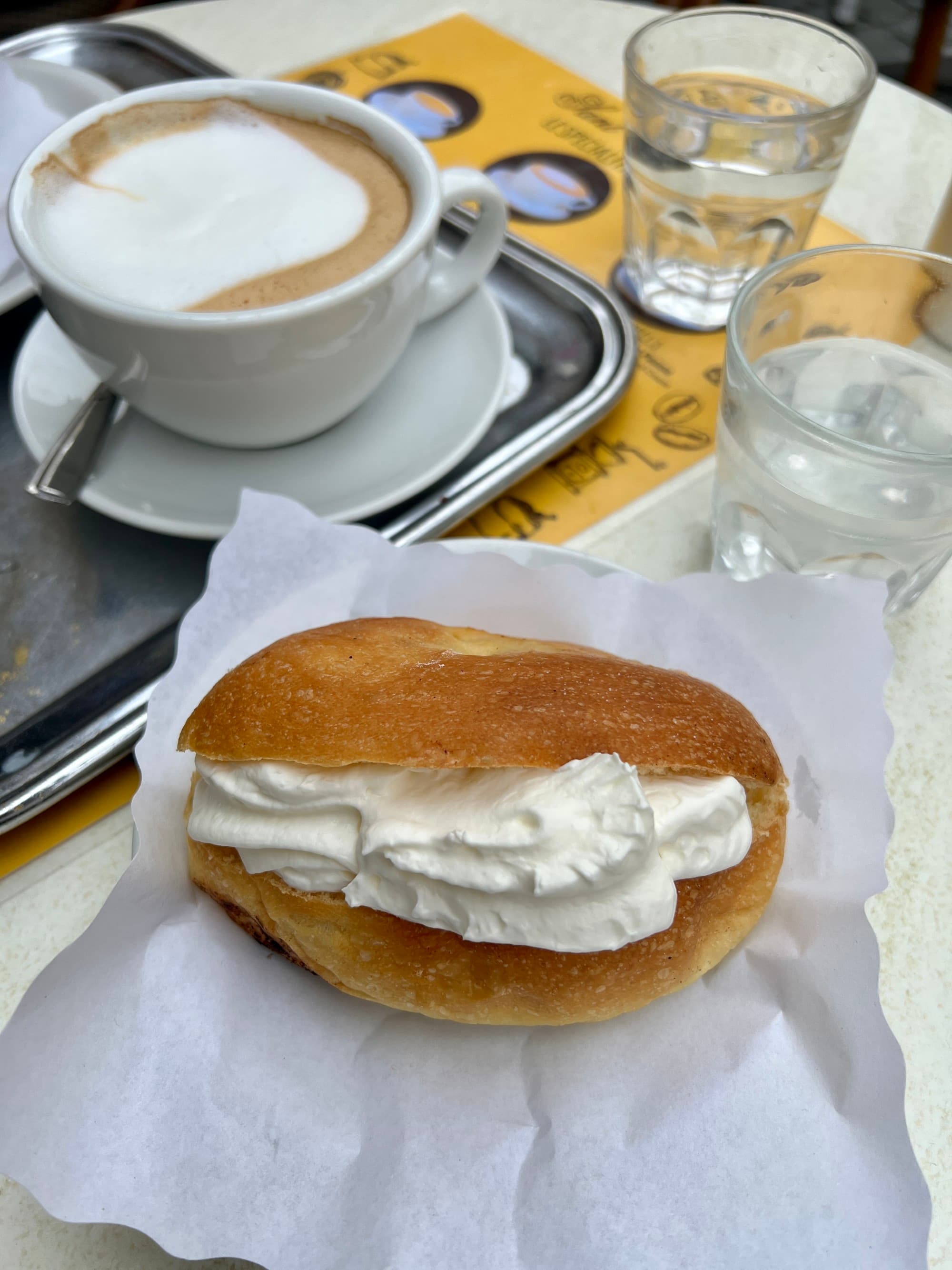 A pastry on white paper on a table