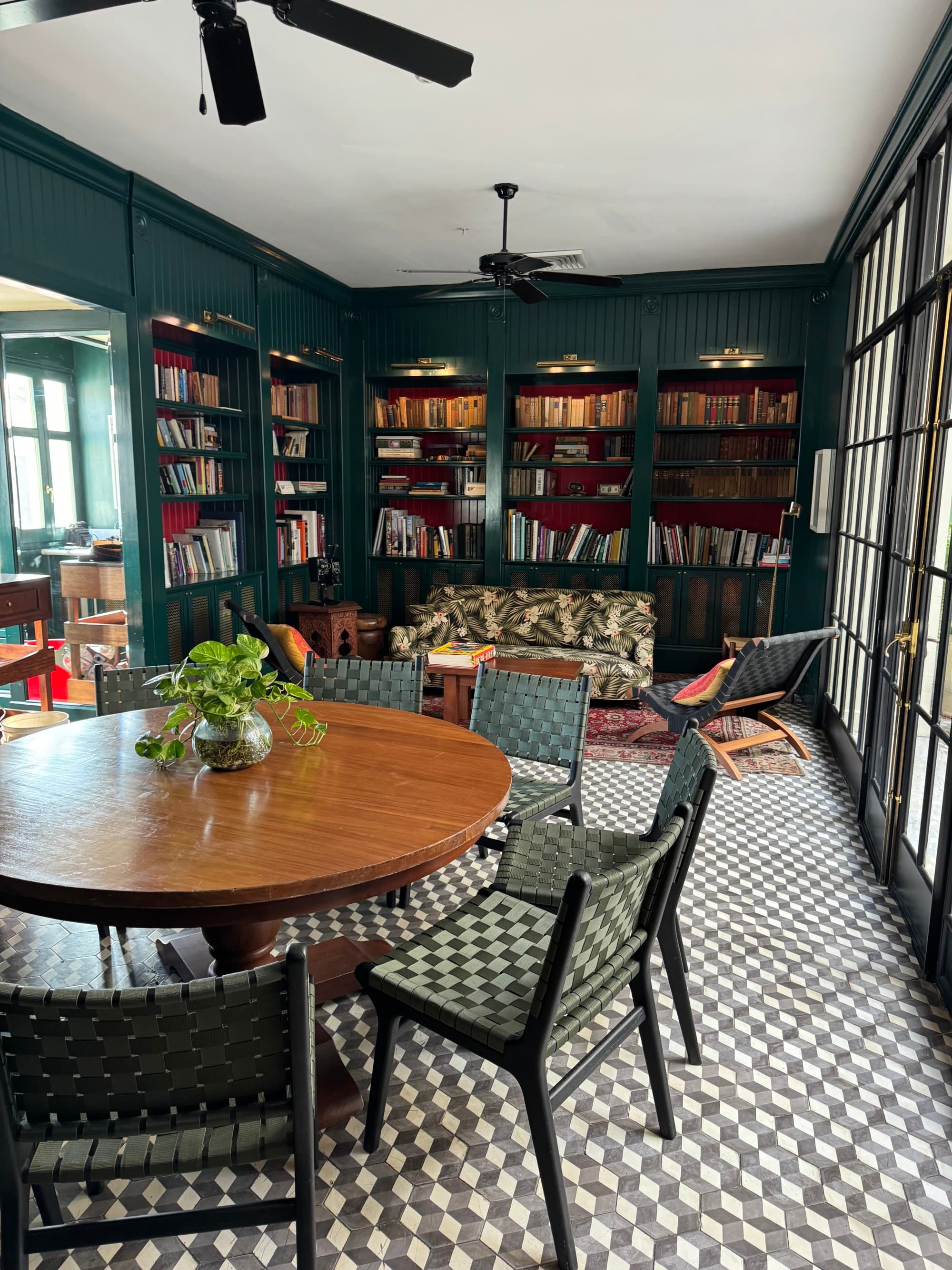 Dining area with a checkered tile floor and lovely ceiling fans.