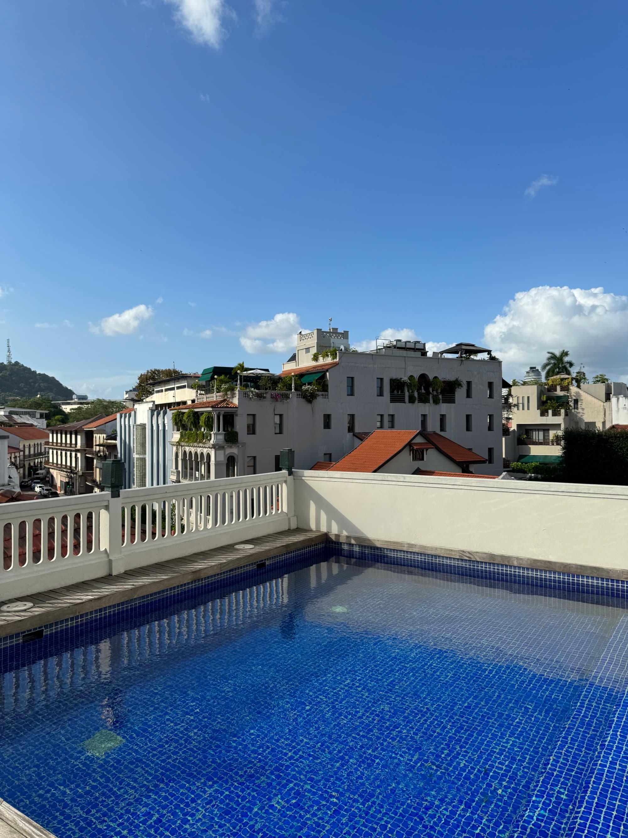 Hotel pool area with a nice view of the surroundings.