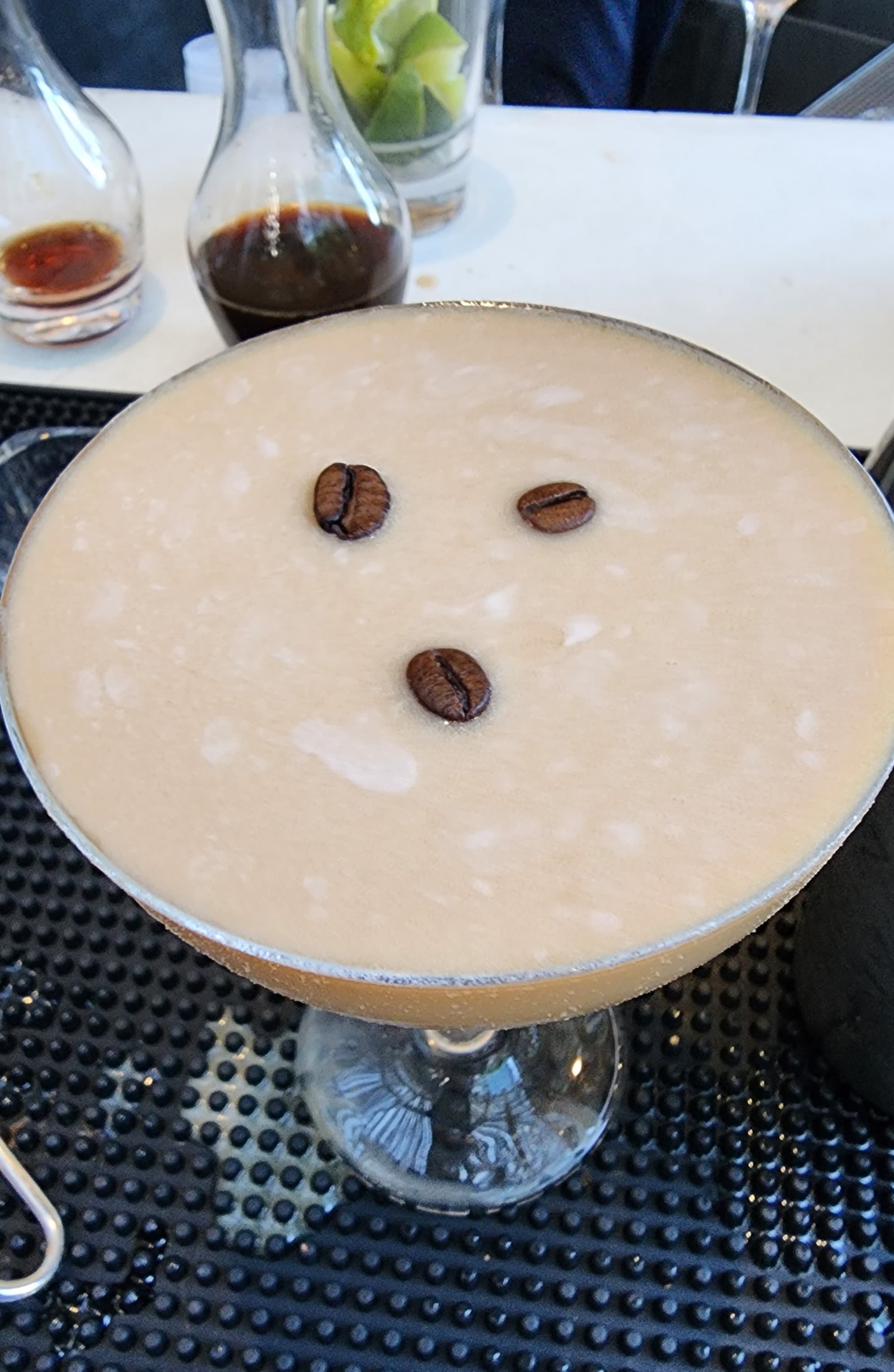 An aerial view of an espresso martini on a bar