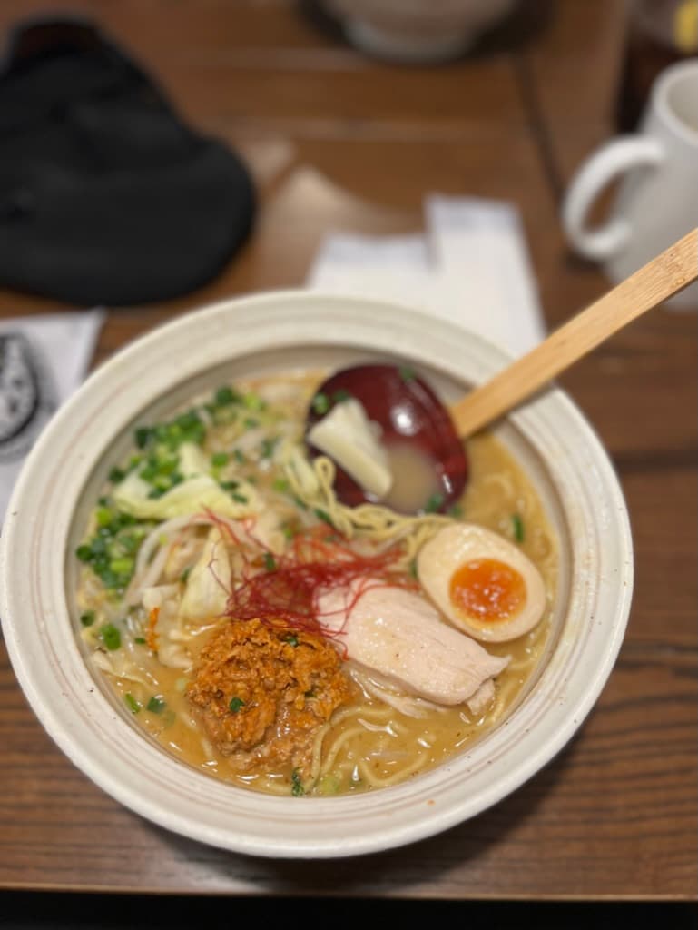 A bowl of ramen on a wooden table in December in Japan.