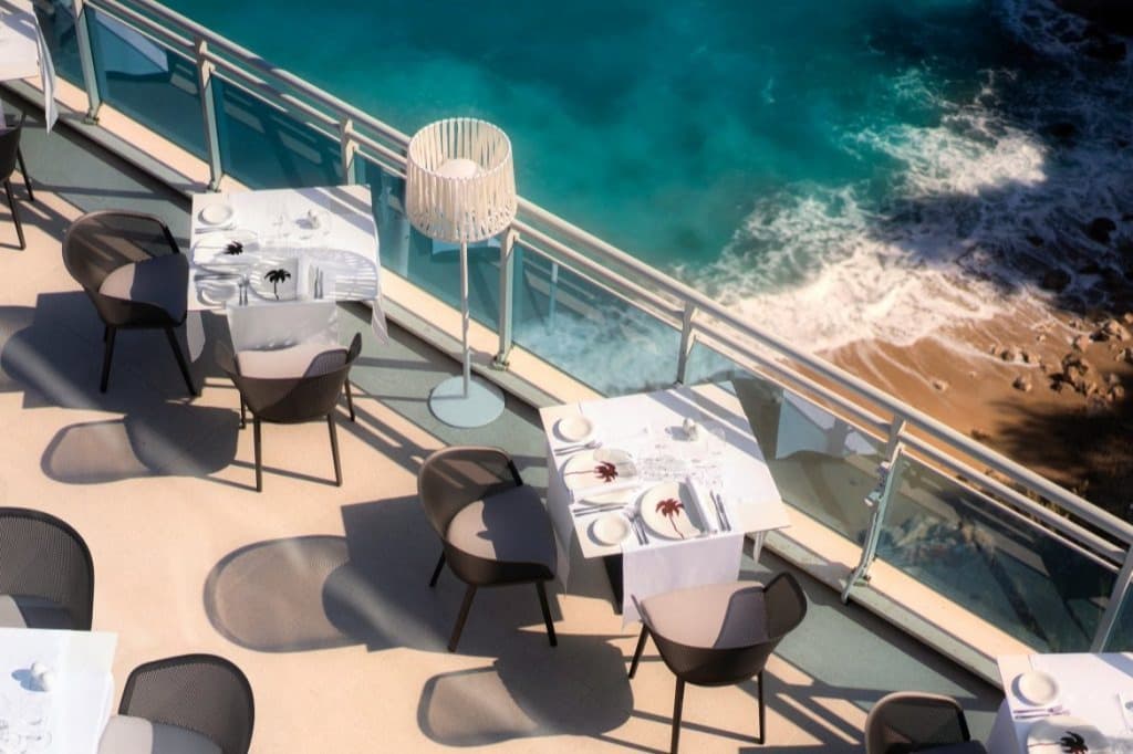 terrace dining tables overlooking beach and sea in Dubrovnik Croatia