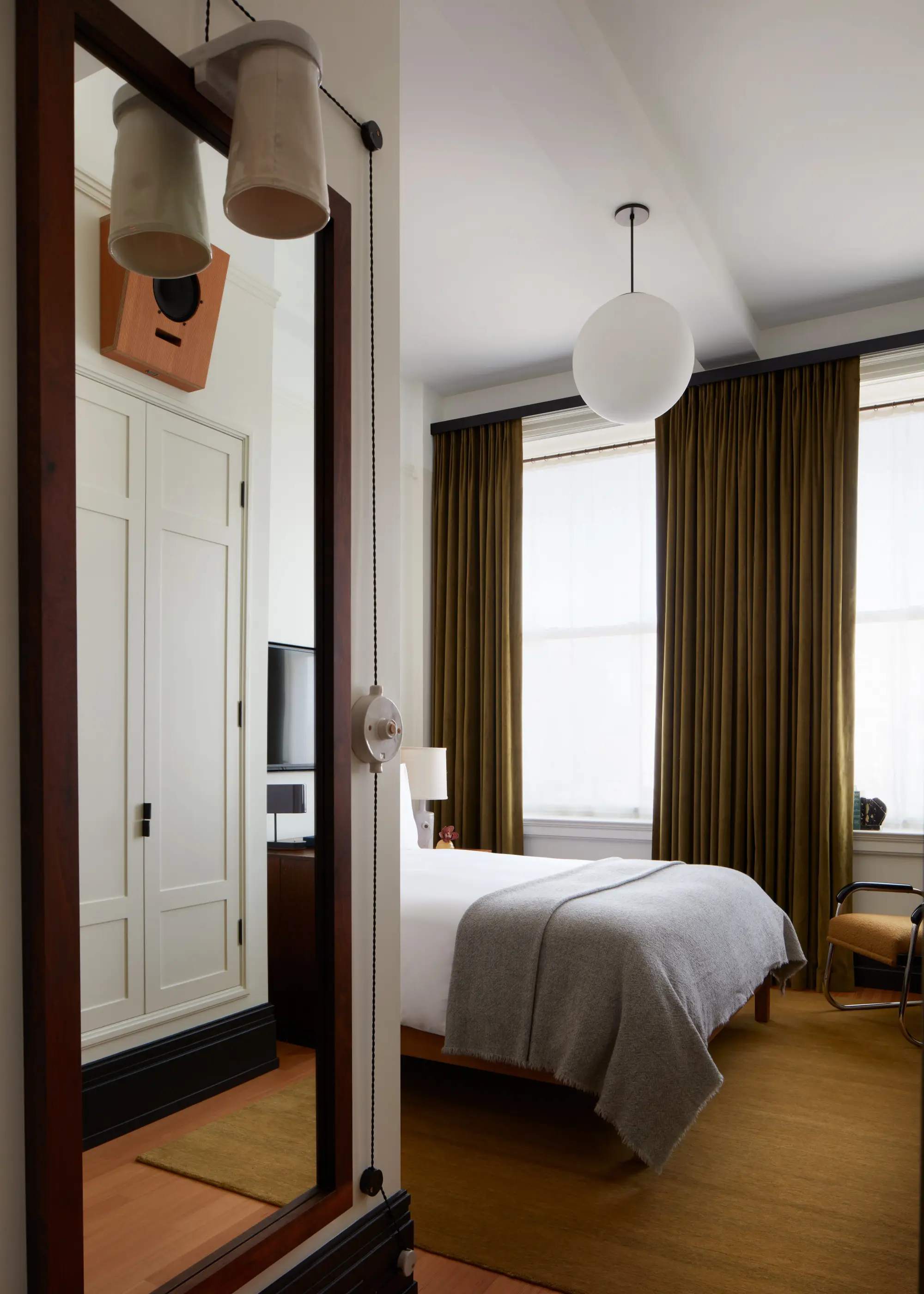 a luxe hotel room with brown carpet and drapes