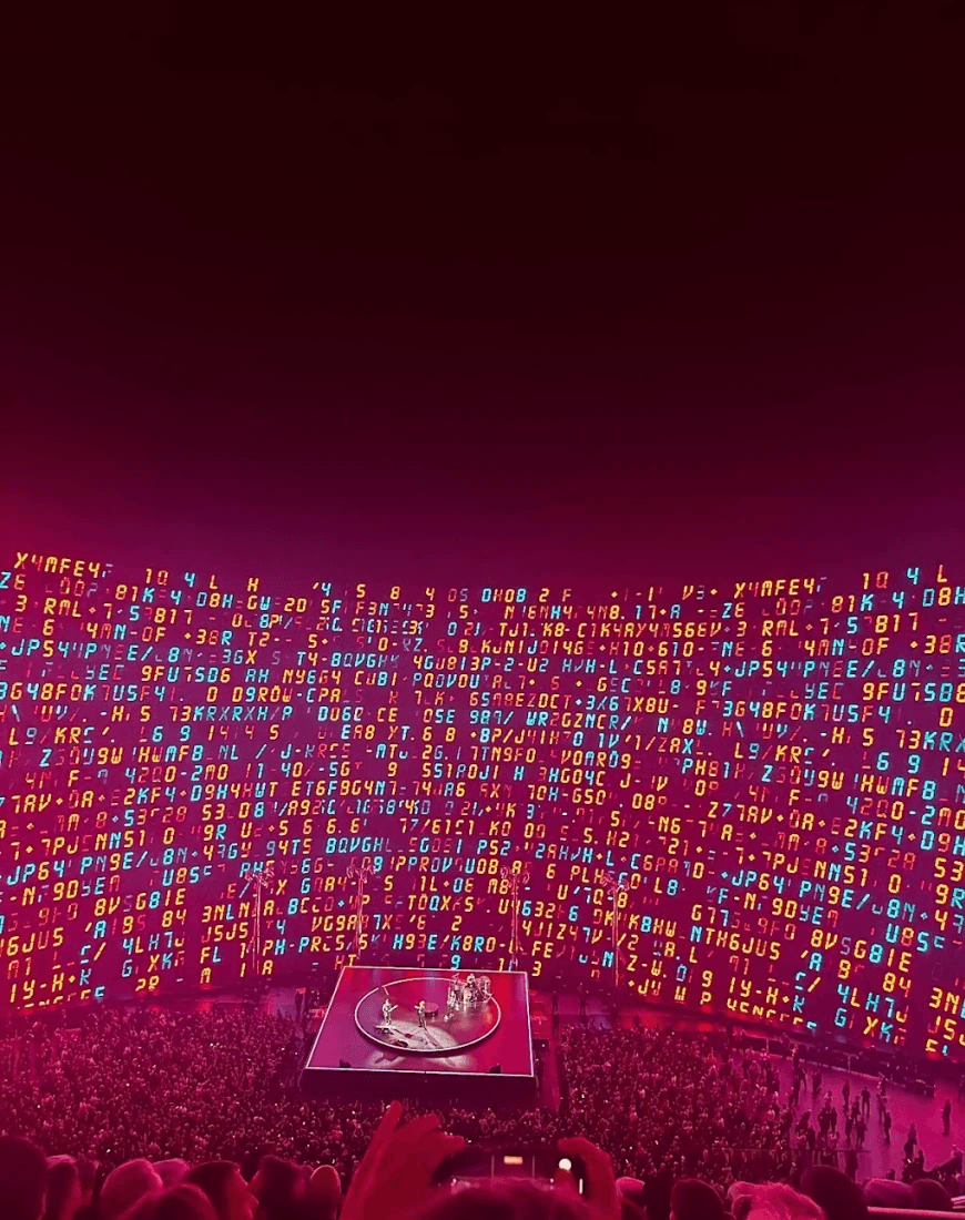 The inside of the Sphere concert venue in Las Vegas with illuminated background and square stage