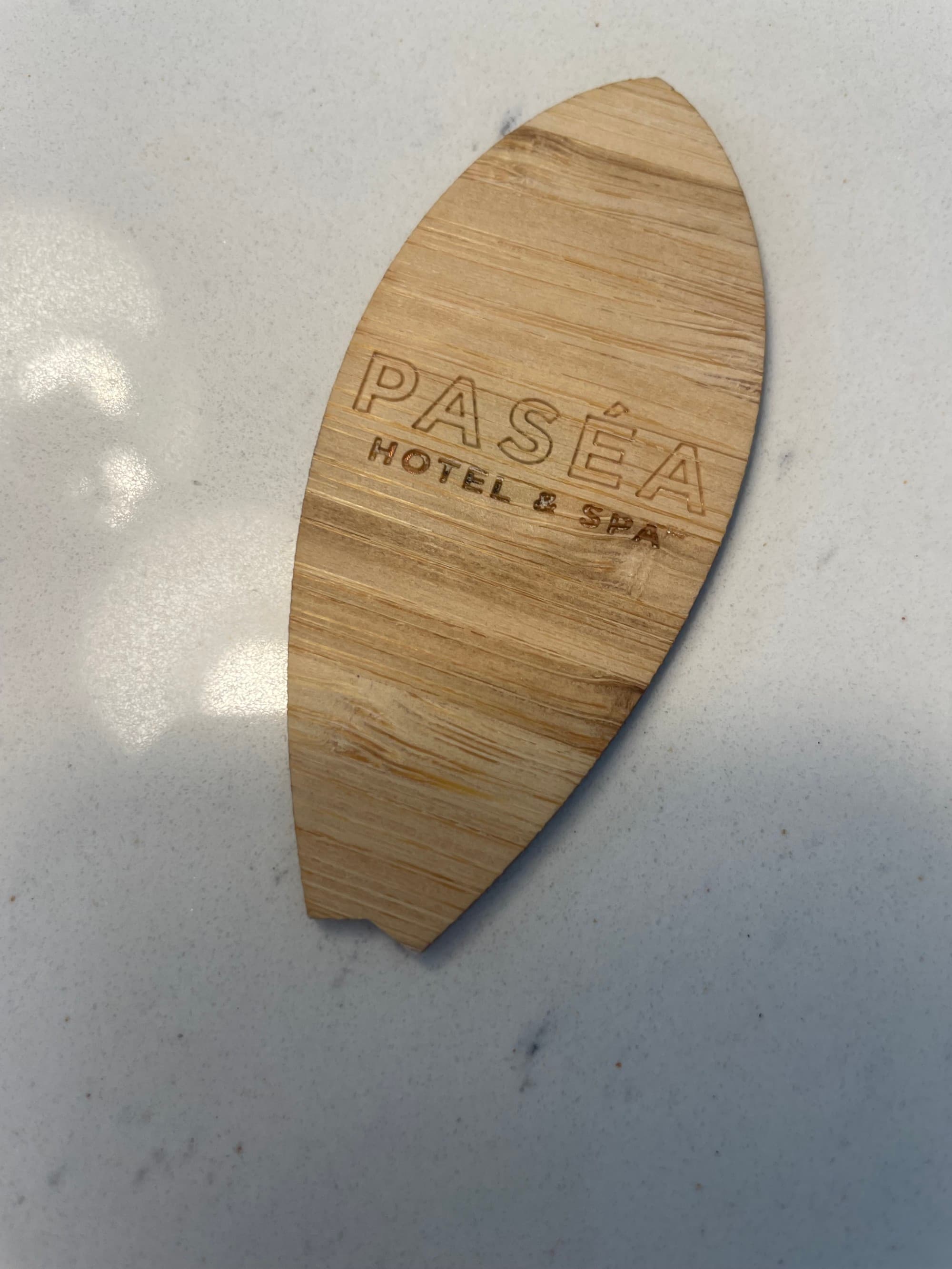 Pasea Room Key styled to look like a wooden surf board - Michelle Roe