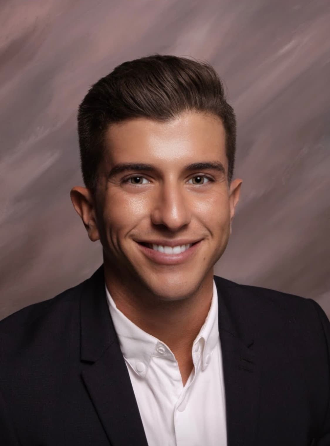 headshot of a man with dark hair