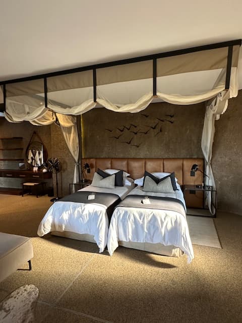 A bedroom with two twin beds.