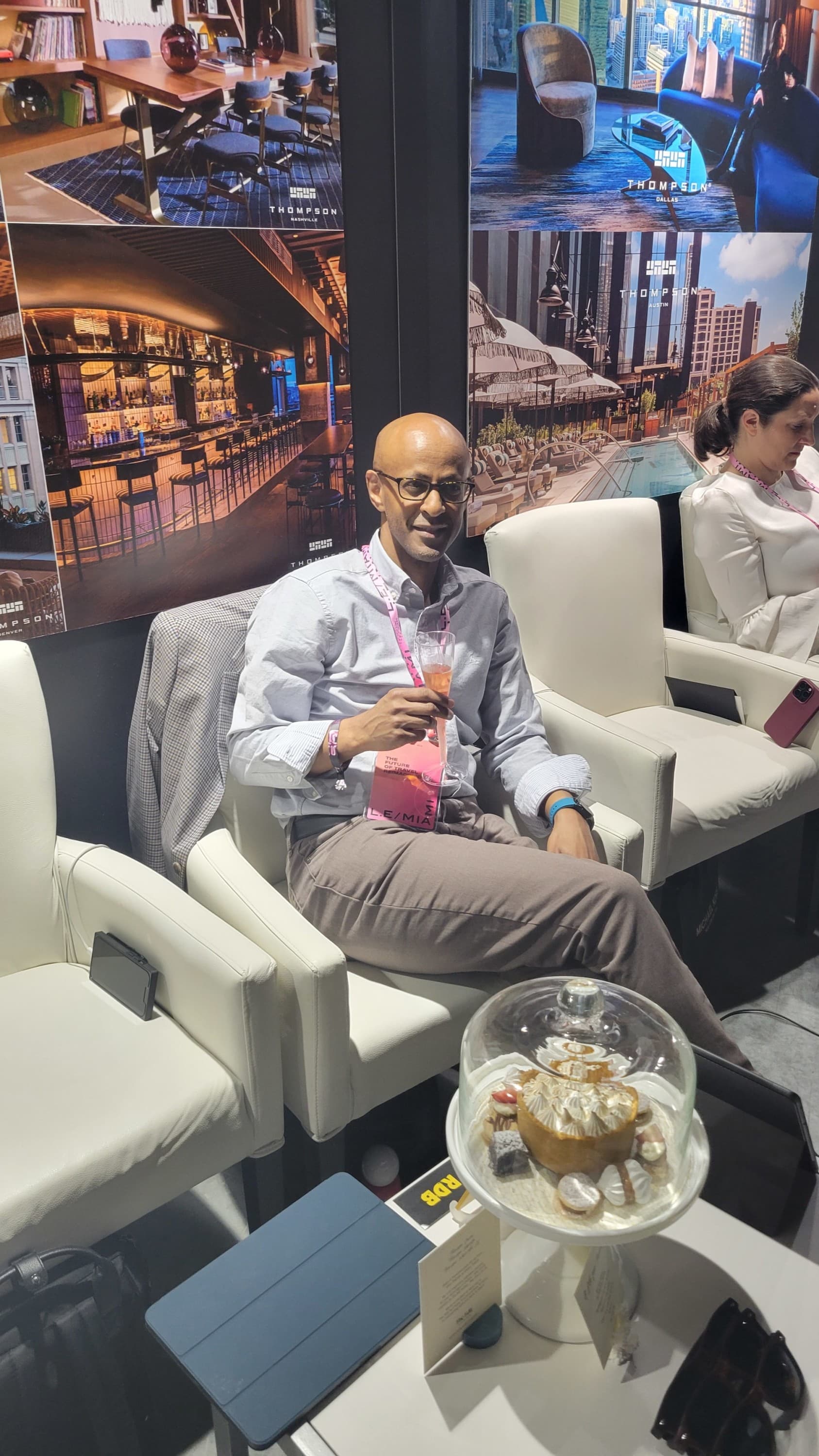 man sitting on a sofa with a glass of wine