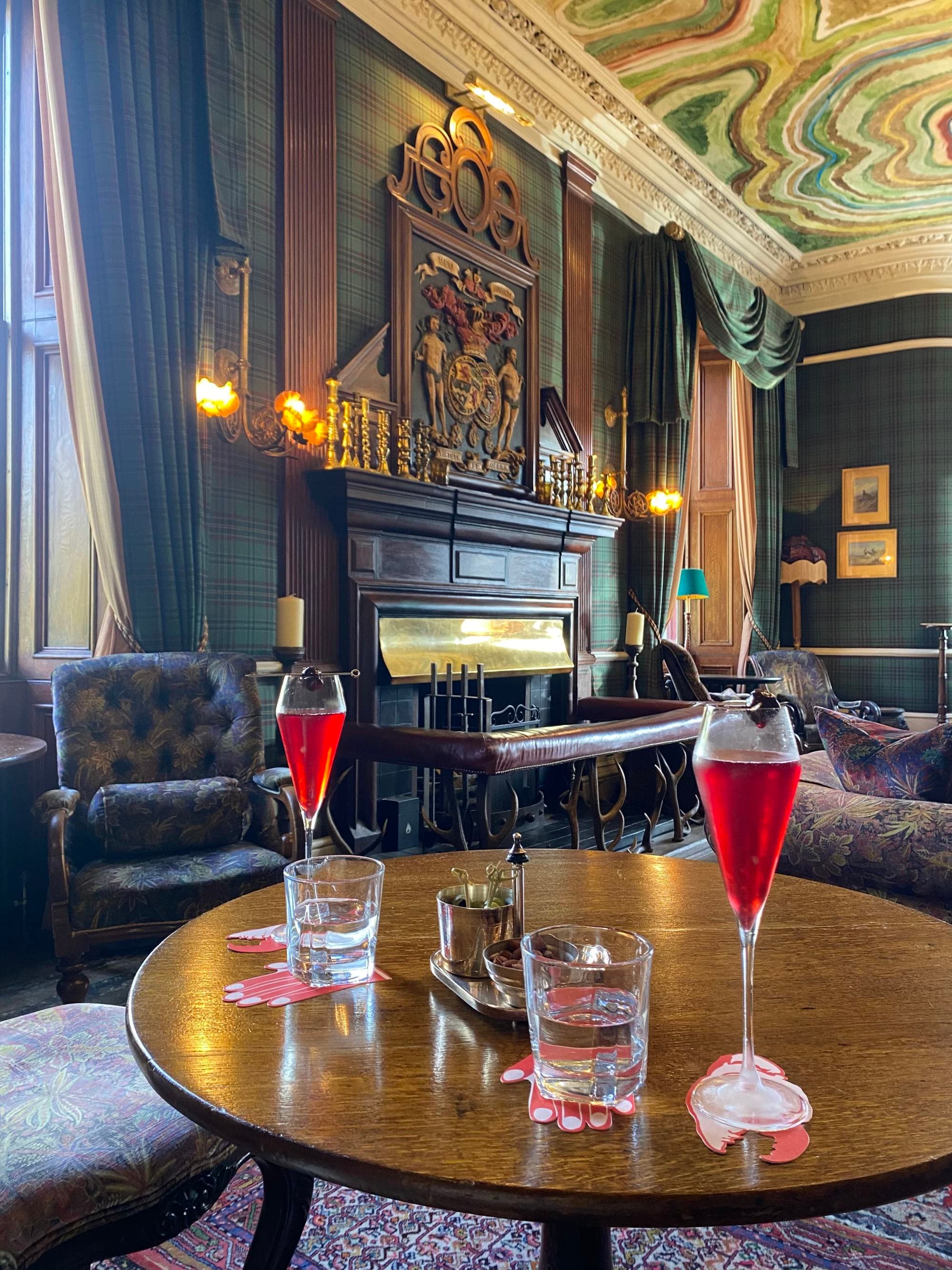 Two cocktails on a table in a lounge.