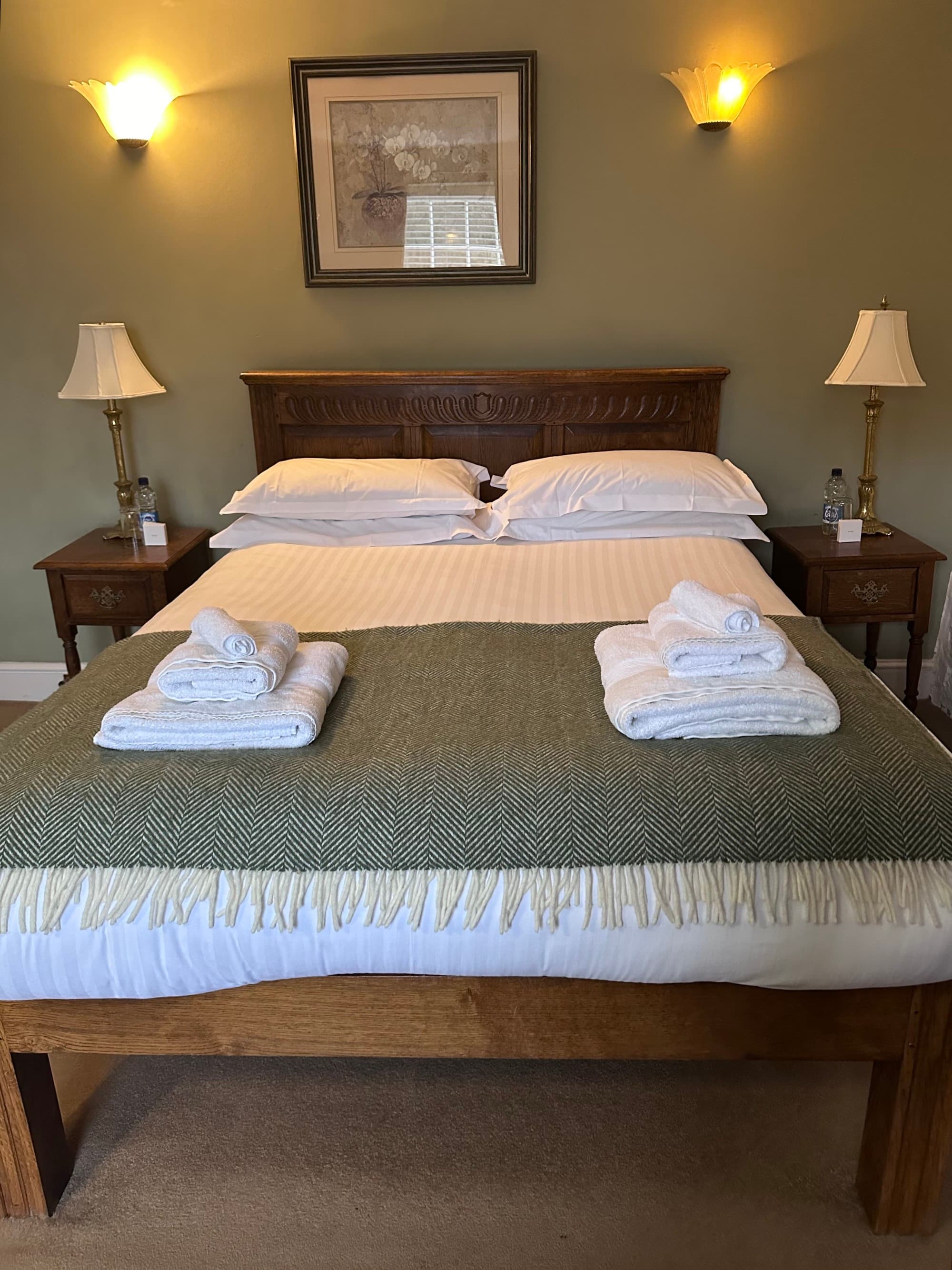 Bed with folded towels.