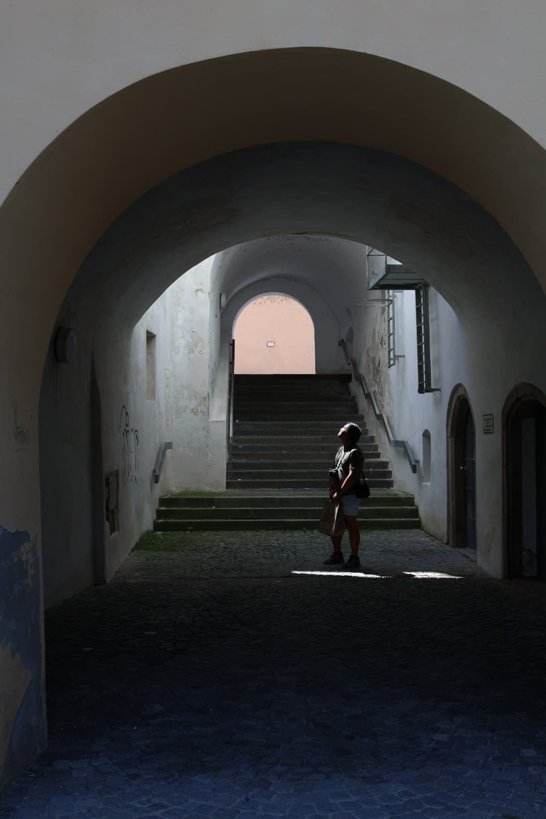 A dark arched corridor