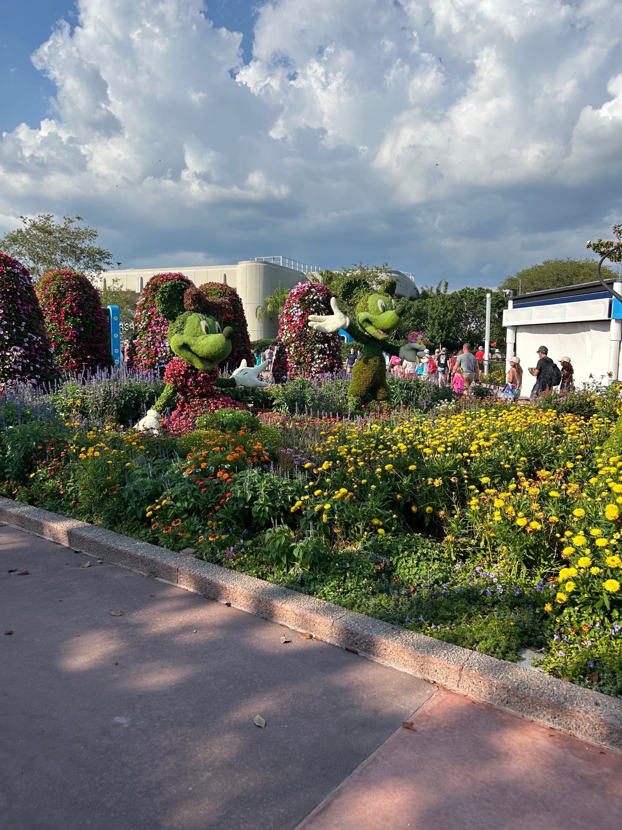 EPCOT International Flower and Garden Festival opens under a bright, cloudy sky.