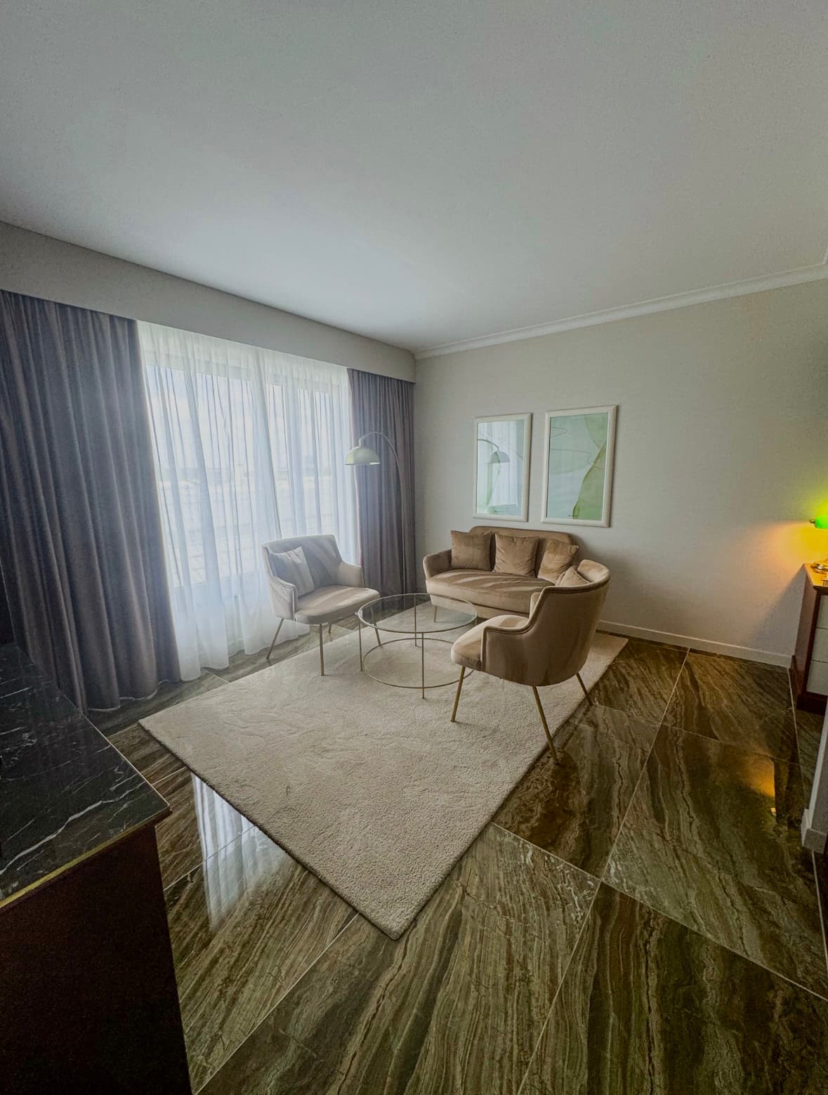 A seating area in a hotel room