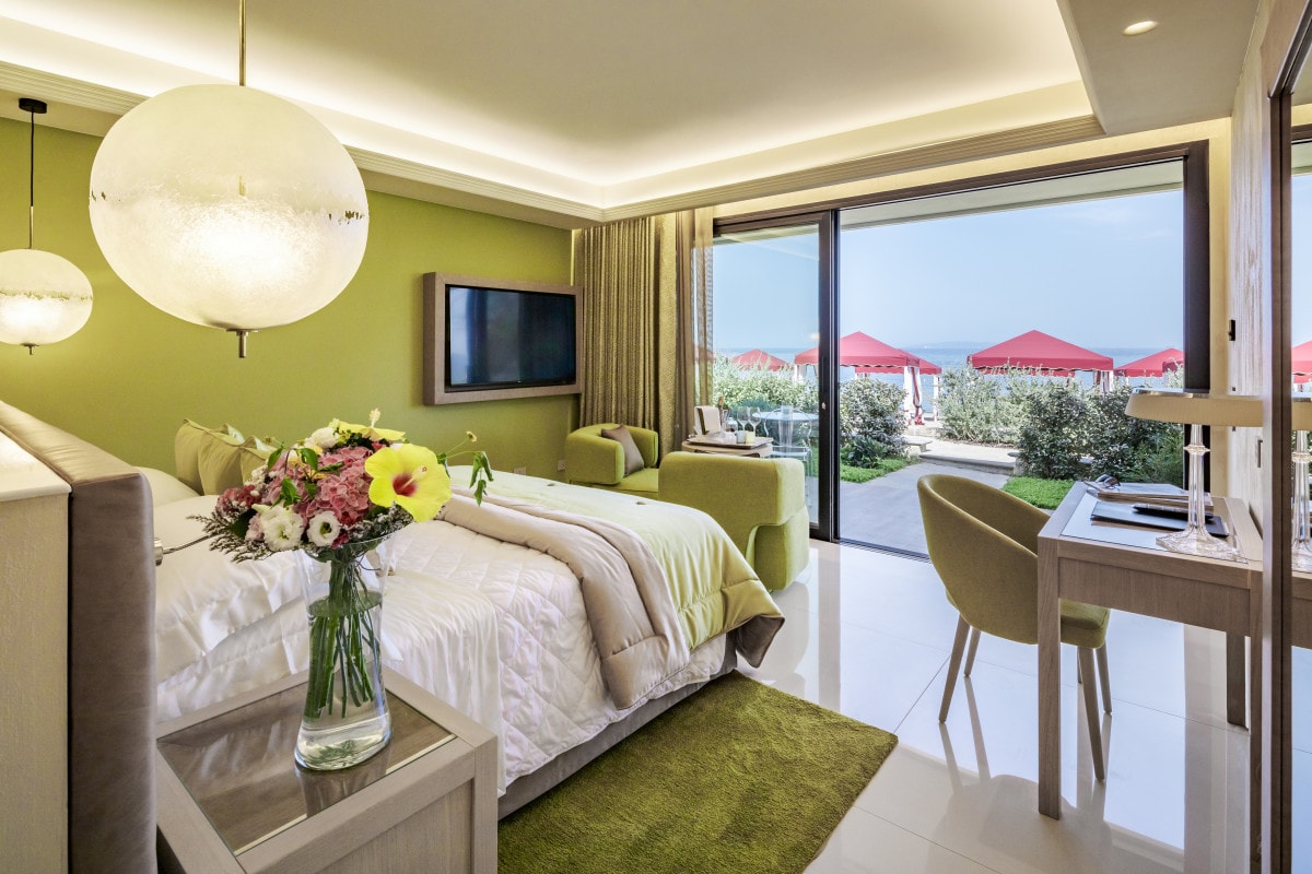 Luxury room overlooking ocean view and cabanas.
