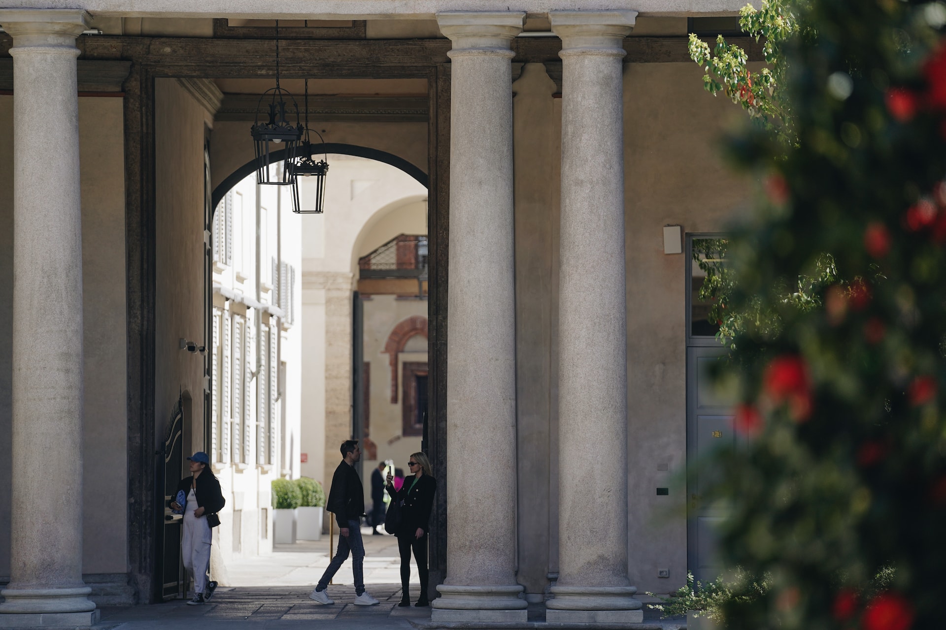 Stone pillars over an entrance to a hotel in Milan