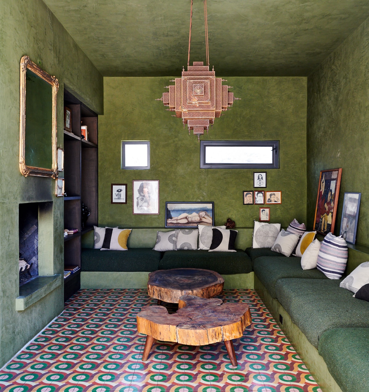stylish library with wooden coffee tables and green walls