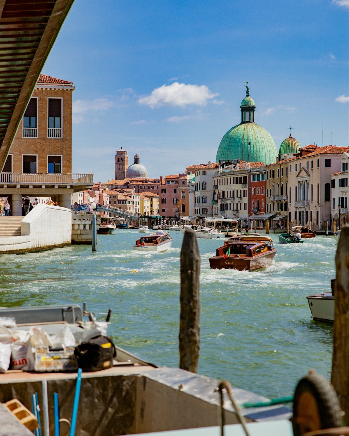 View of Italian city from boat on a bright day.
