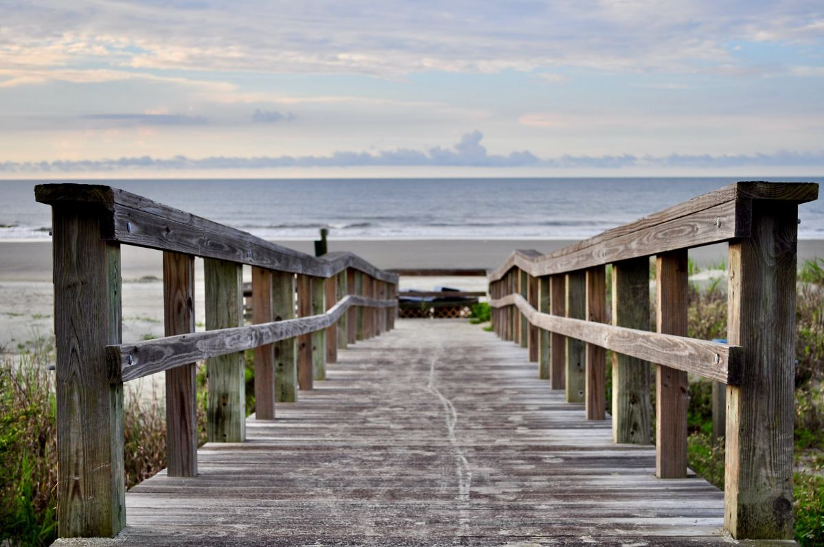 Wooden bridge leading down to a beach