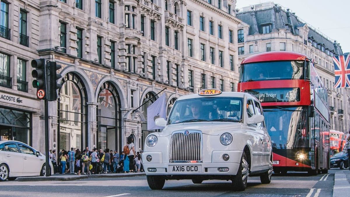 a view of cars on the street in the united kingdom.