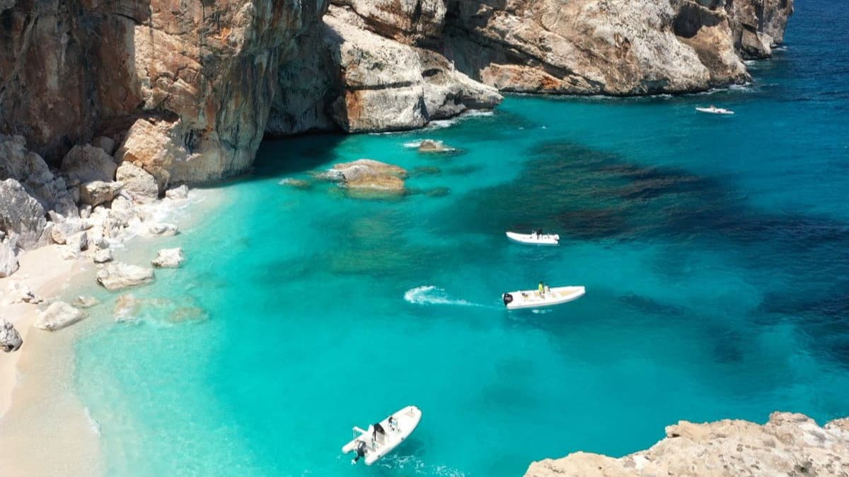 Cliffside by a body of water and a beach