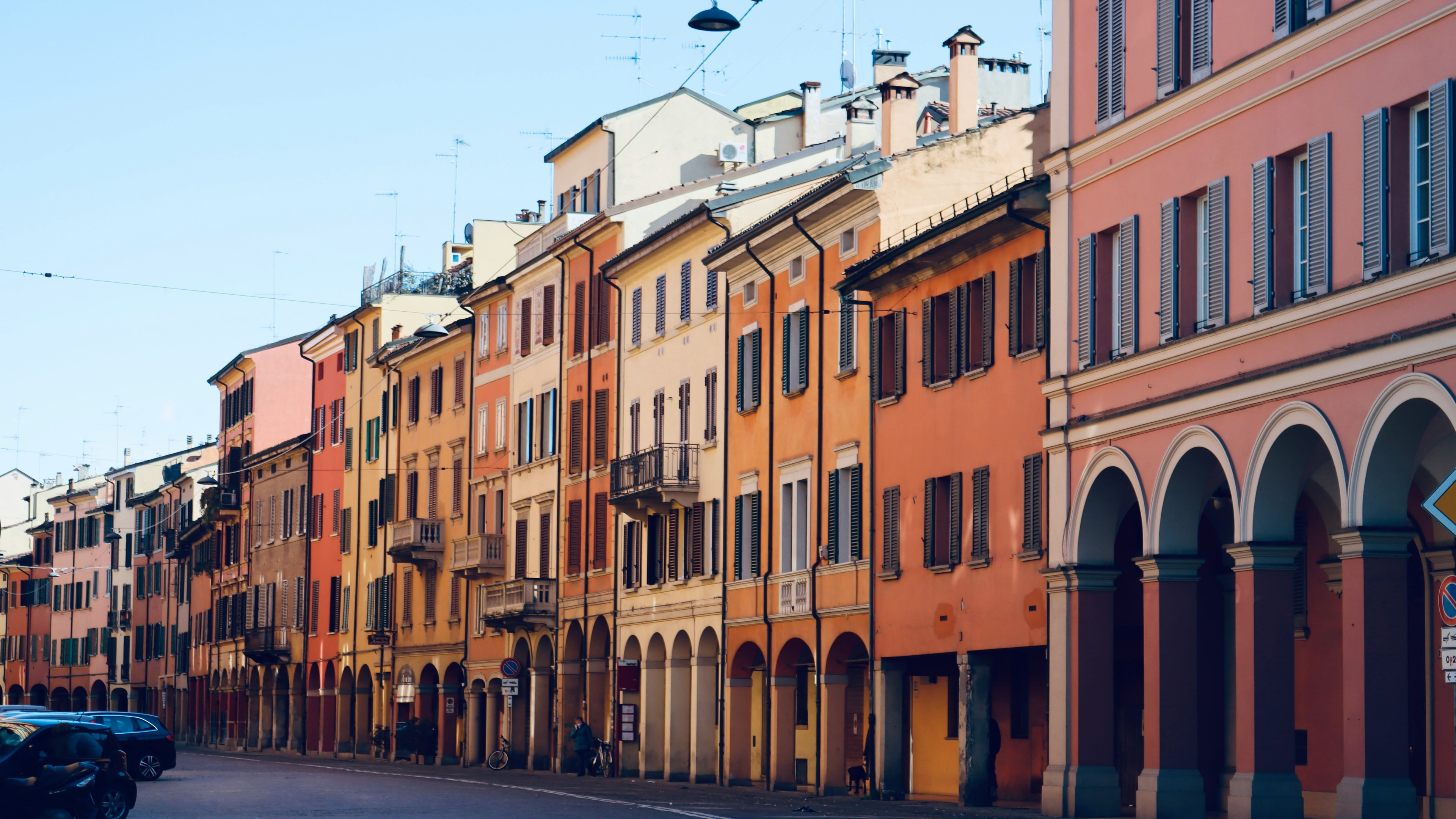 Orange houses along a road in Bologna.