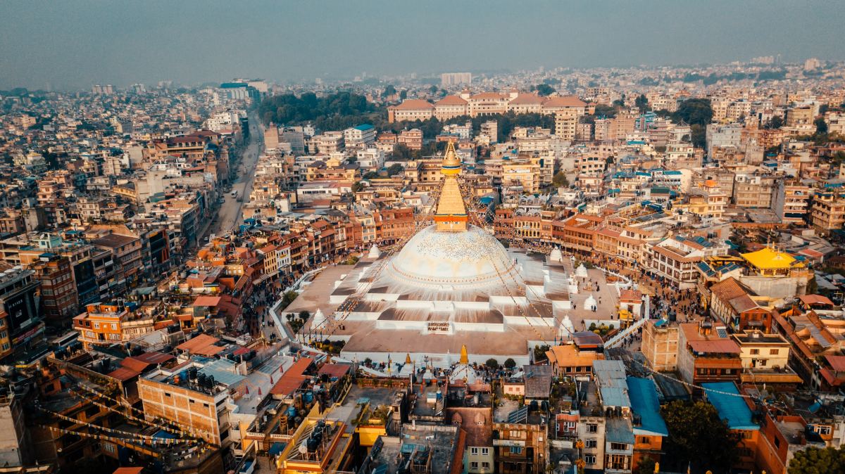 Aerial view of city buildings centered around a large dome