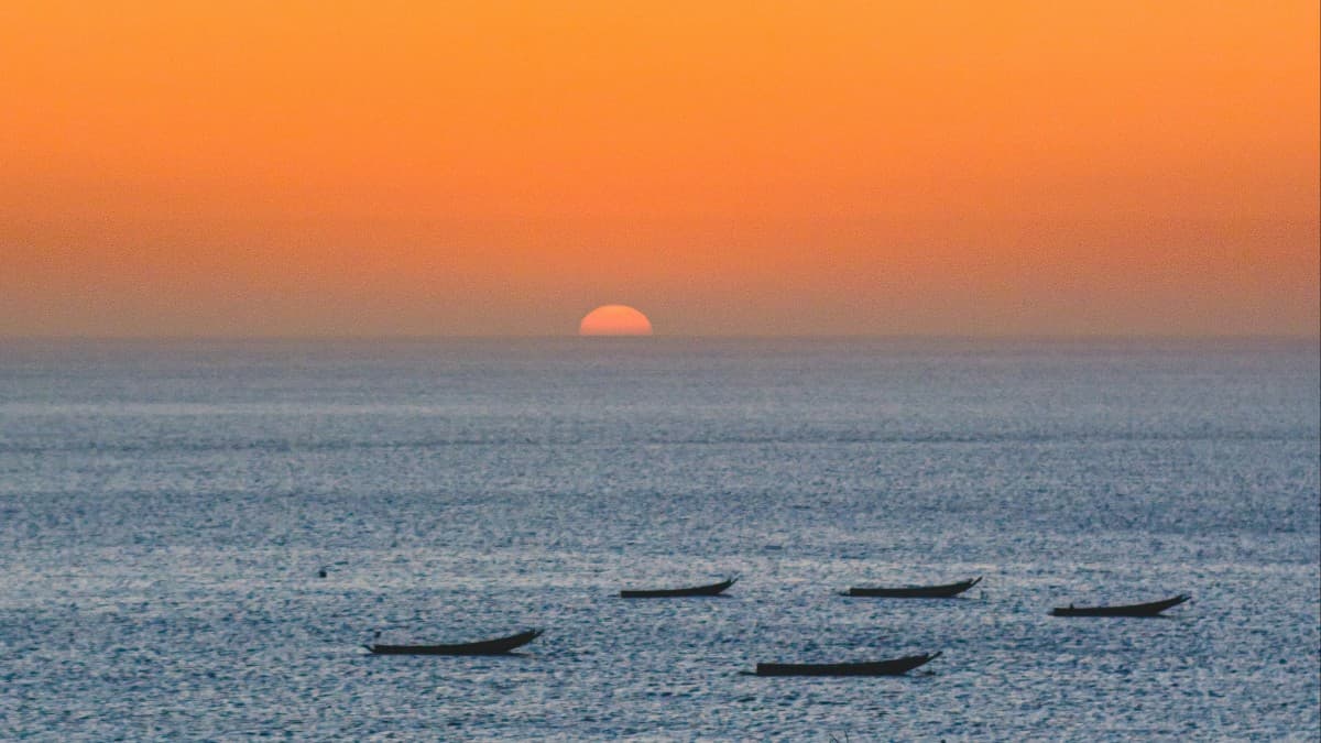 A beautiful sunset over a body of water in Senegal.
