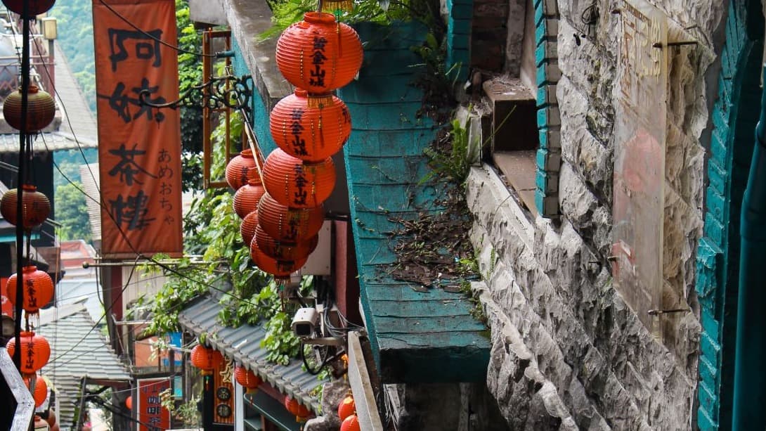 alley way with hanging red lanterns