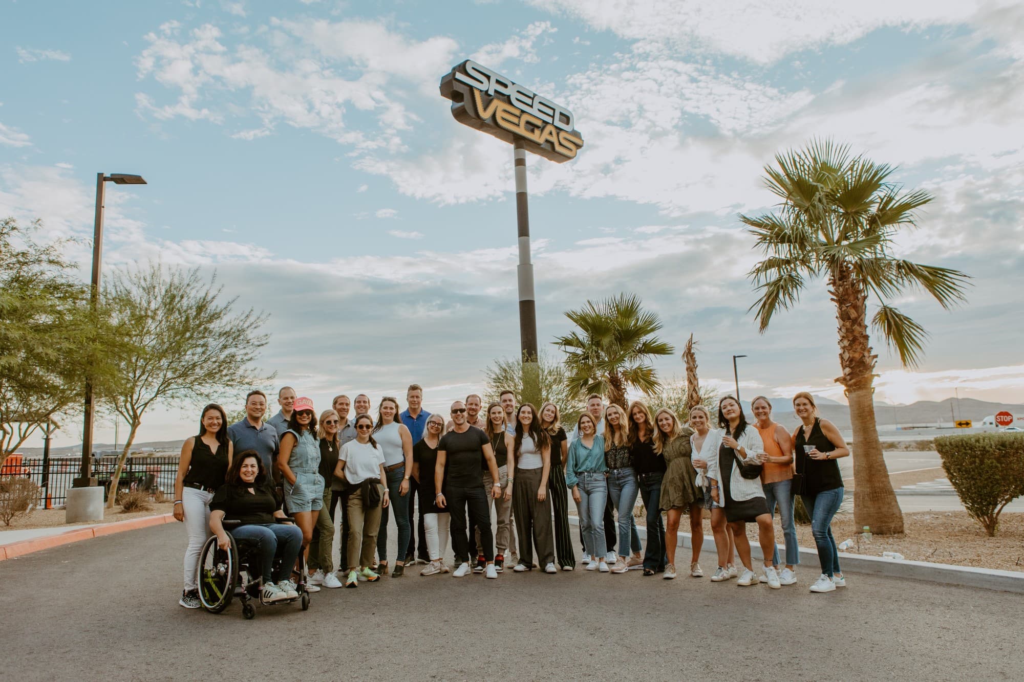 Fora team in front of "Speed Vegas" sign