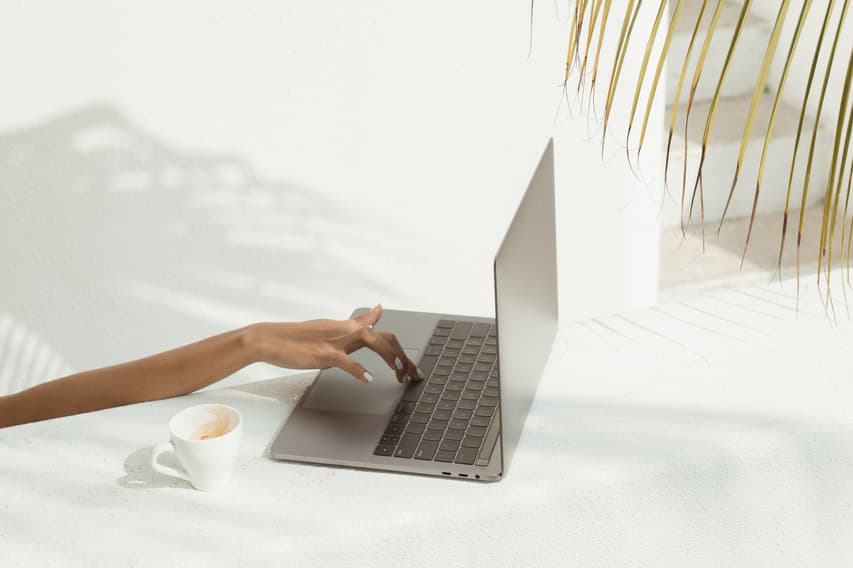 Woman uses a computer from far away