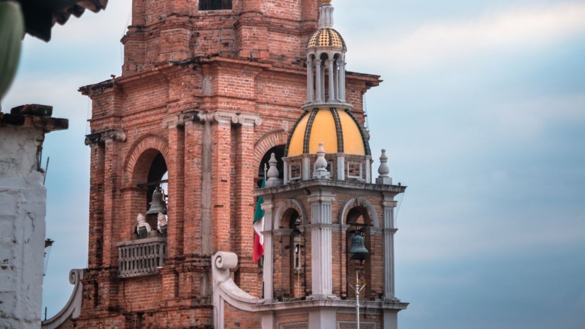 Brown and black concrete building with clock