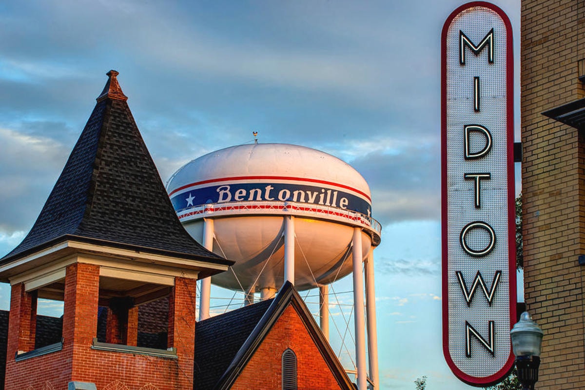An aerial view of the Bentonville water tower and a sing from Midtown.
