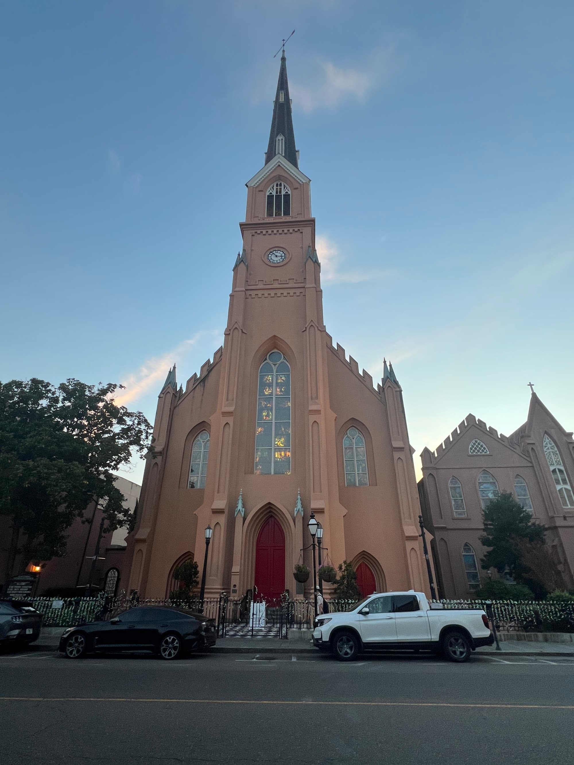 The outside of a church building under a blue sky