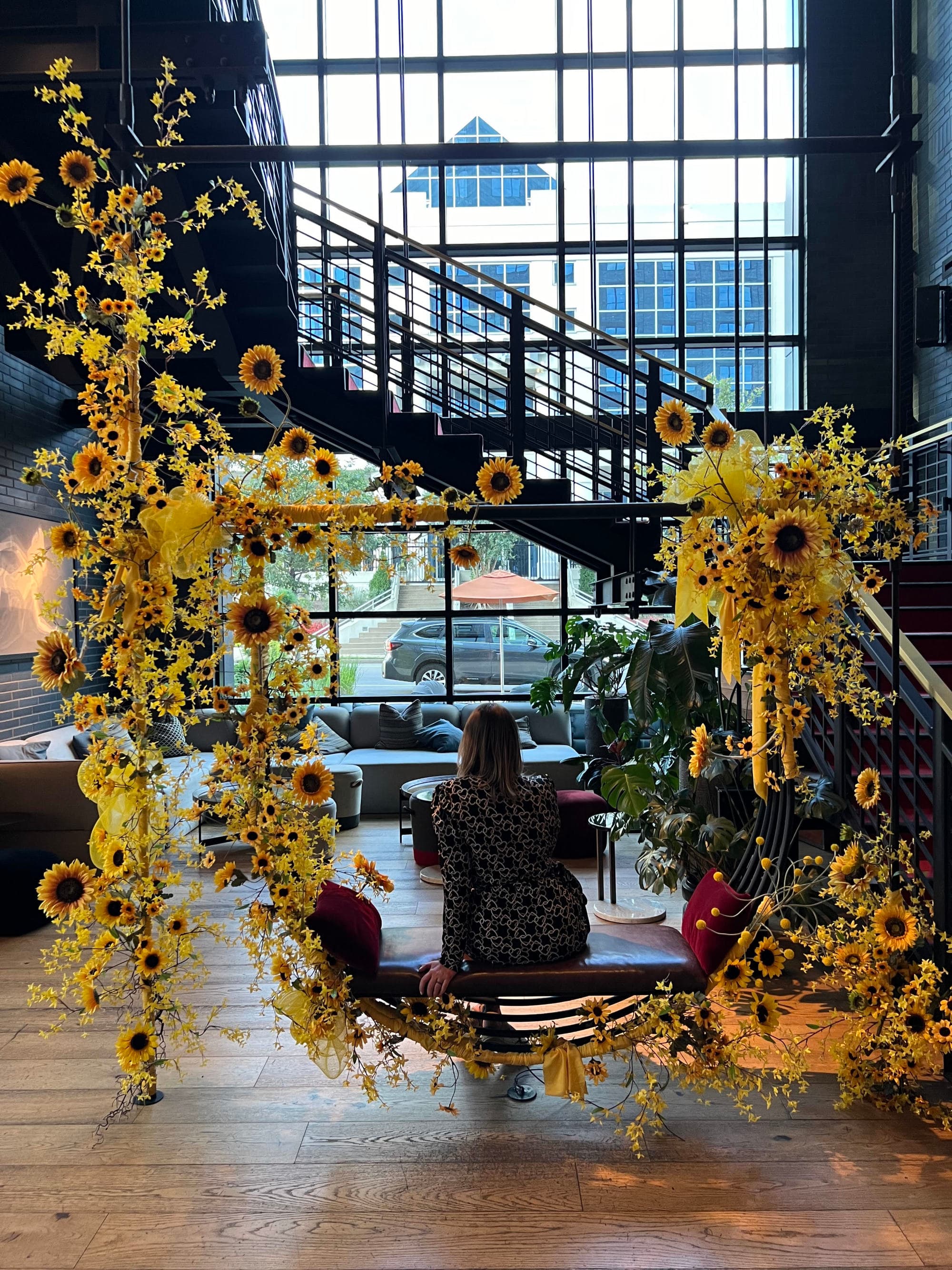 A hotel lobby with a floral art installation