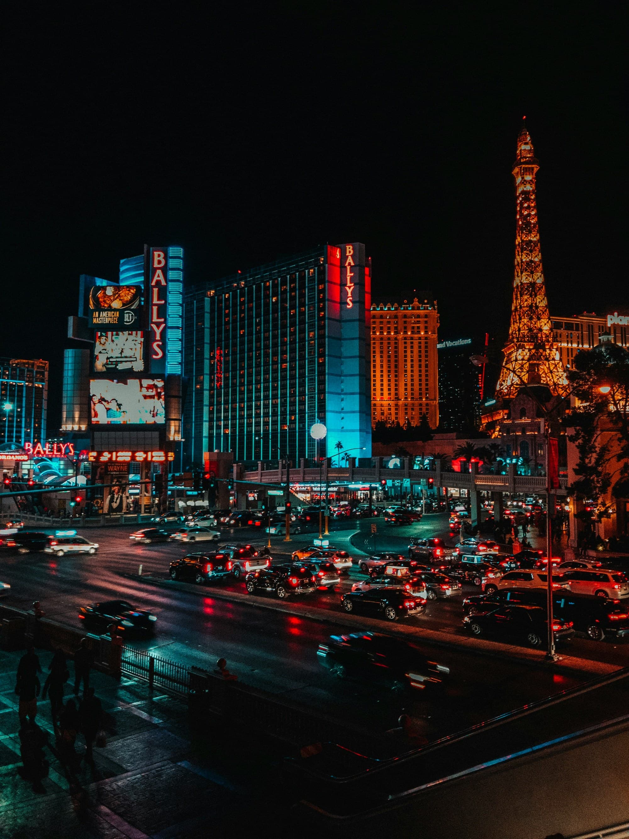 A downtown area with city buildings lit up at night