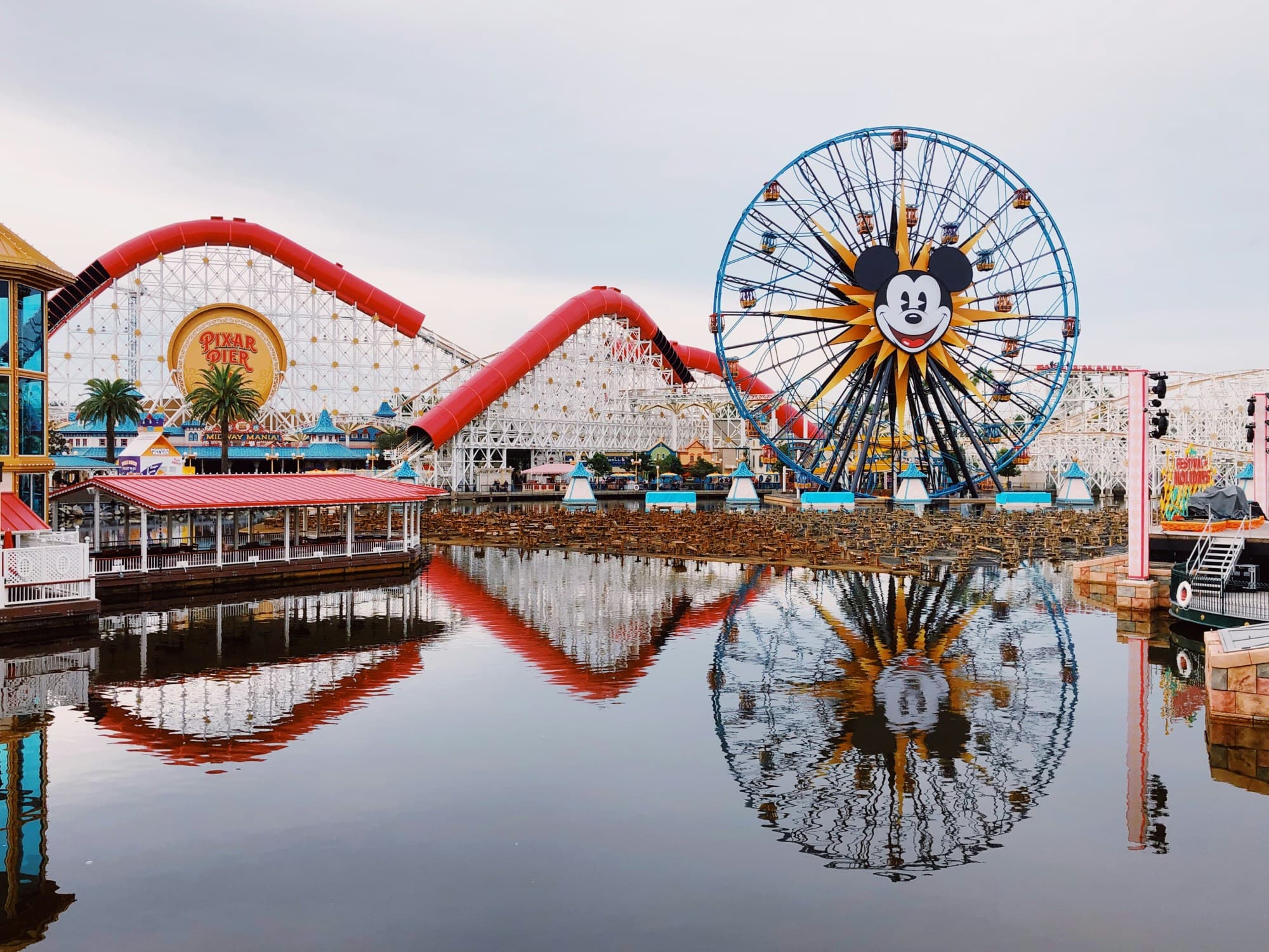 View of Disneyland Park overlooking the water on a cloudy day.