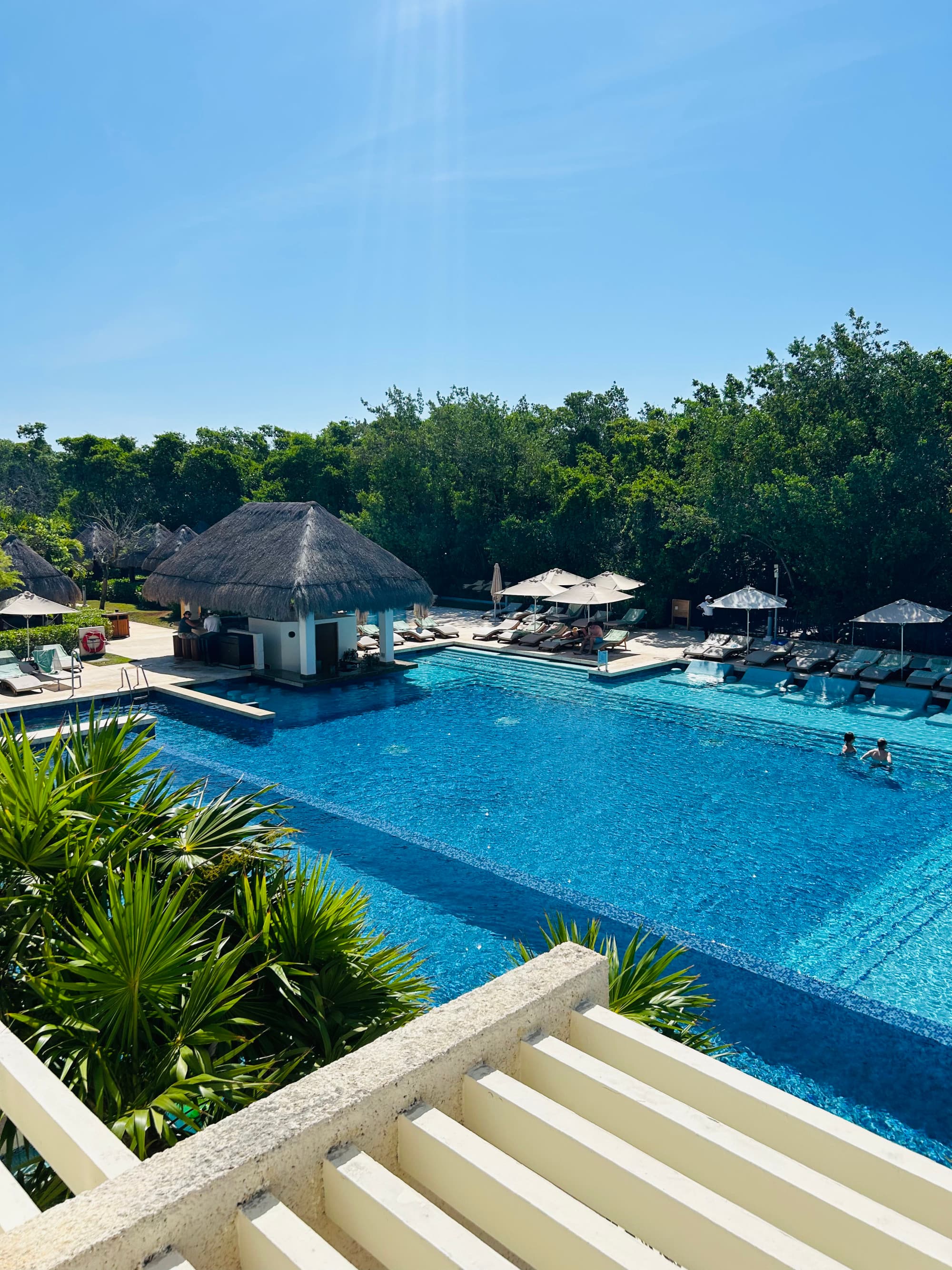An outdoor swimming pool area during the daytime