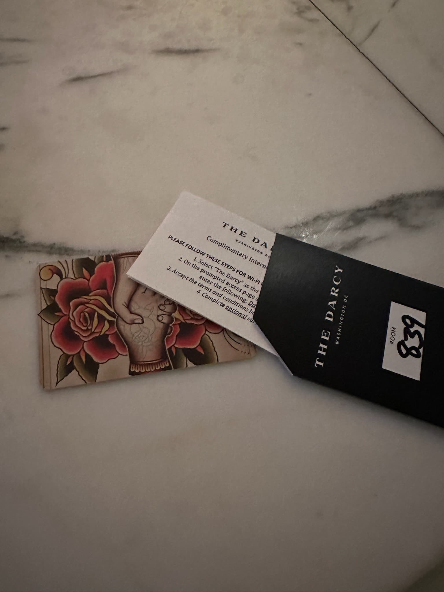 A picture of the room key and envelope for The Darcy hotel