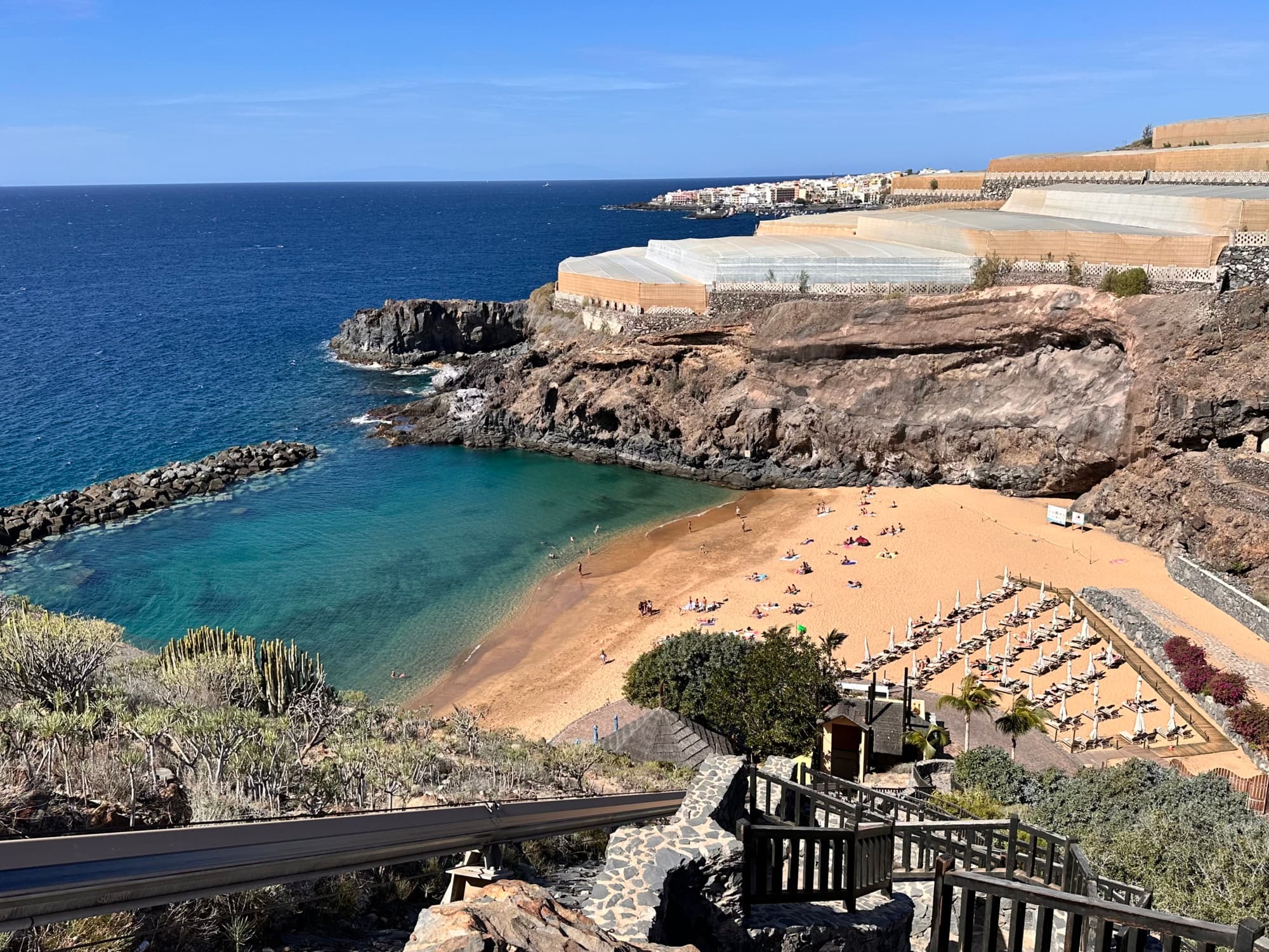 The Beach Club - Alexa Romanelli. A beautiful decent to the beach with an enclave of water.