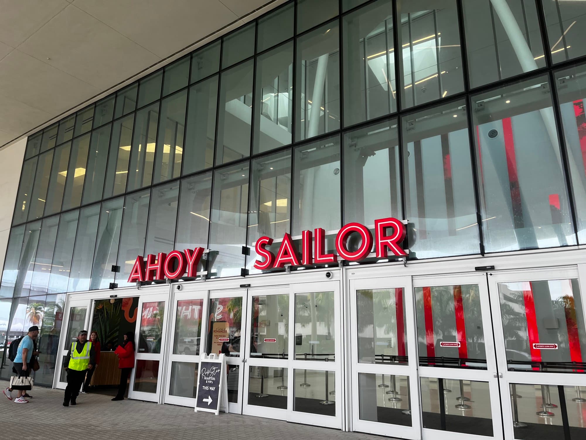 AHOY SAILOR written in red on a glass building