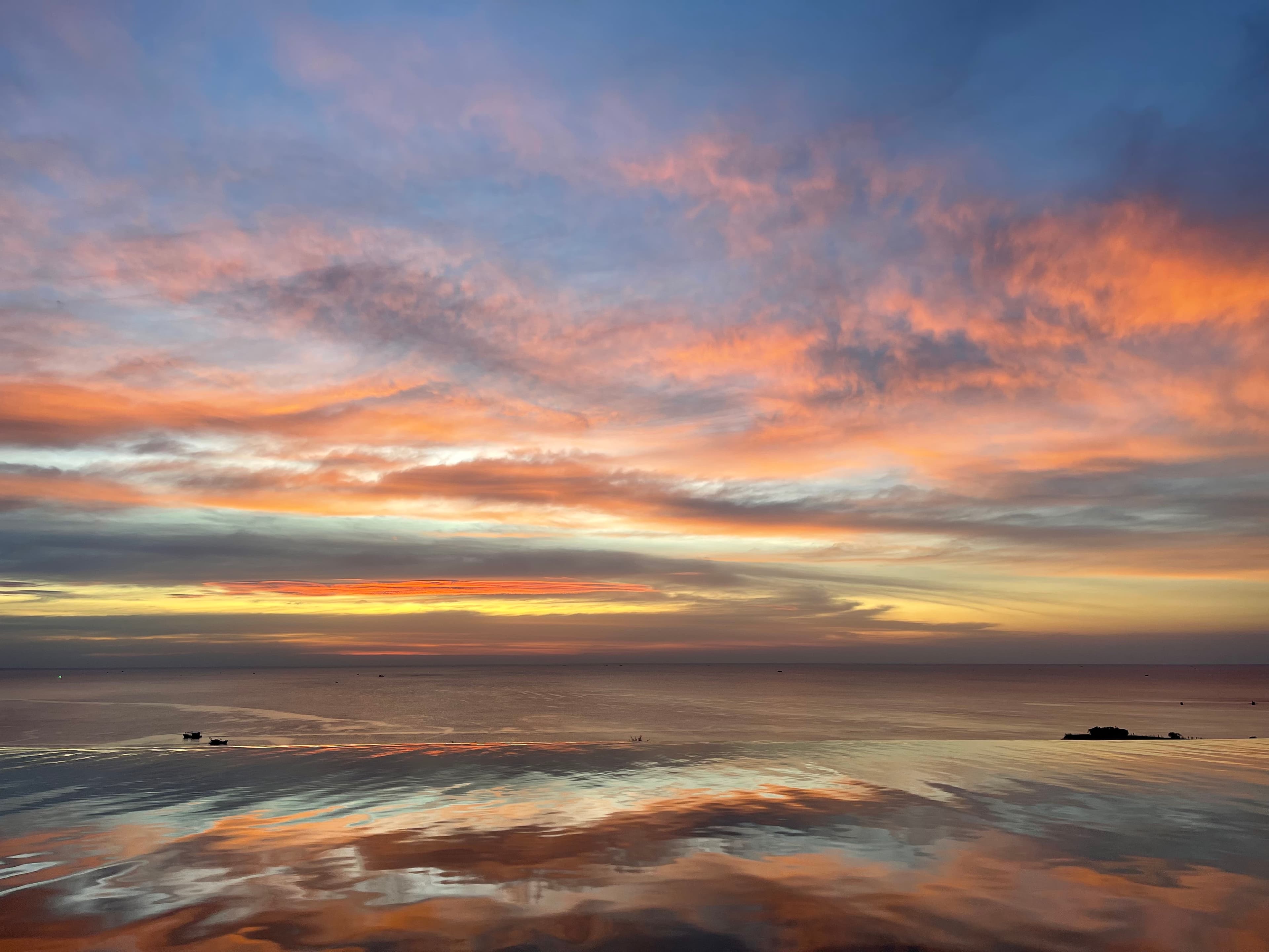 Beautiful view of sunset with orange, pink and yellow sky.