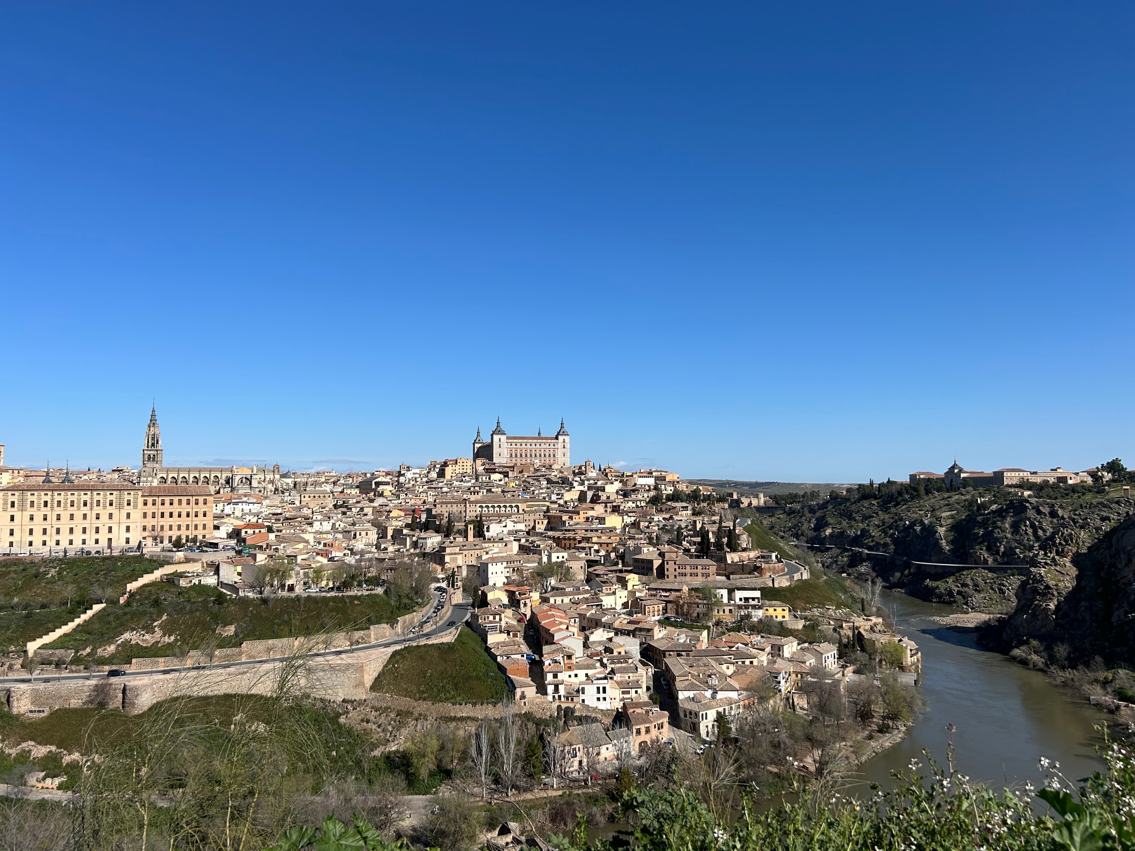 Aerial view of Toledo, Spain with buildings and river on a sunny day
