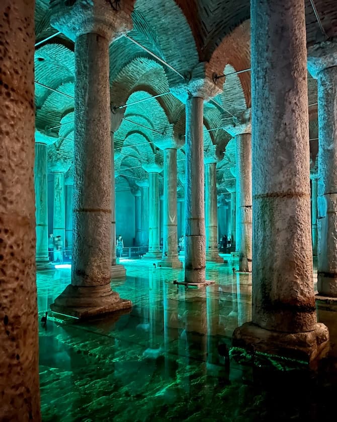 Picture of the inside of a beautiful building lit up with green lighting